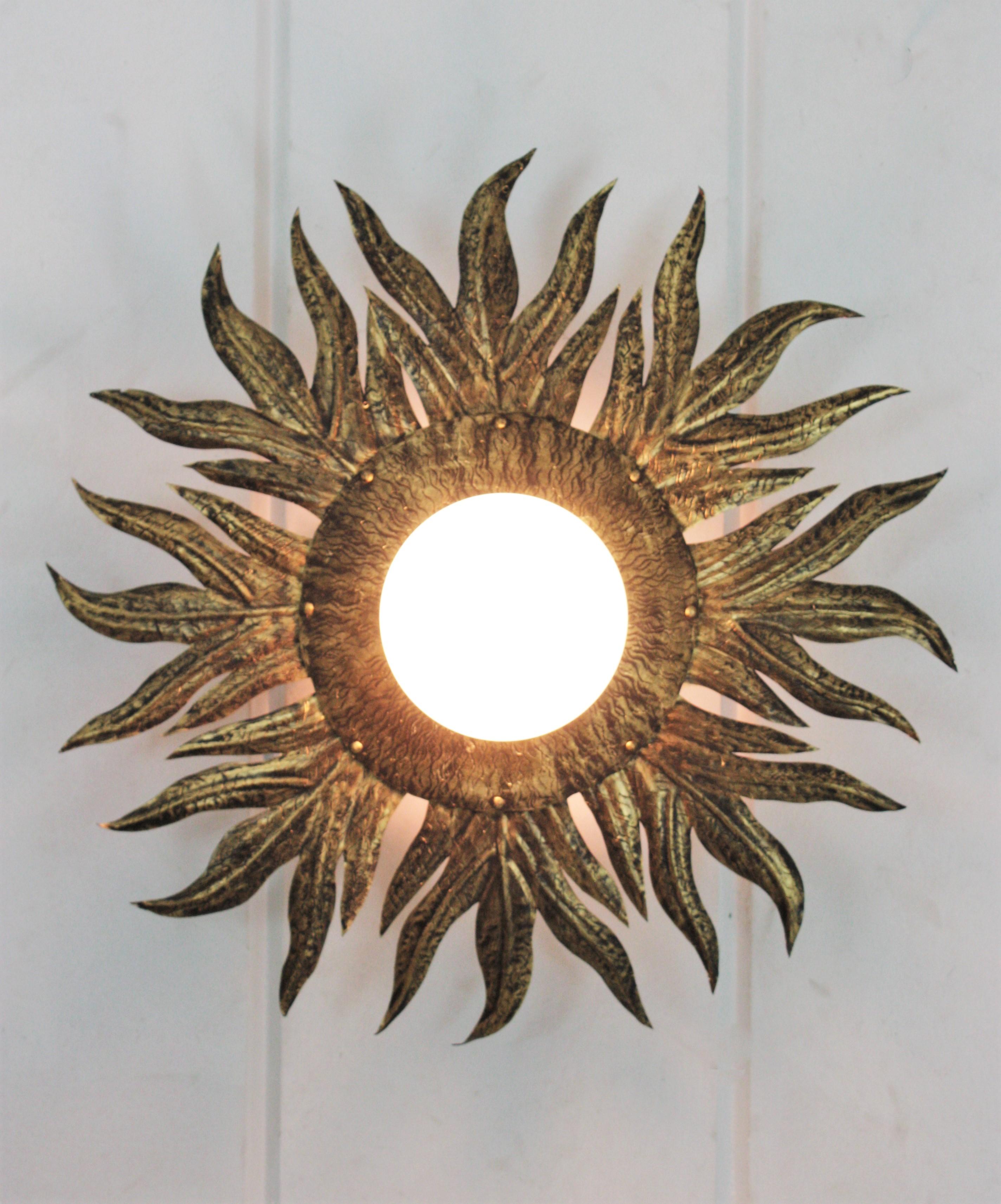 Sunburst Light Fixture in Gilt Metal and Milk Glass For Sale 1