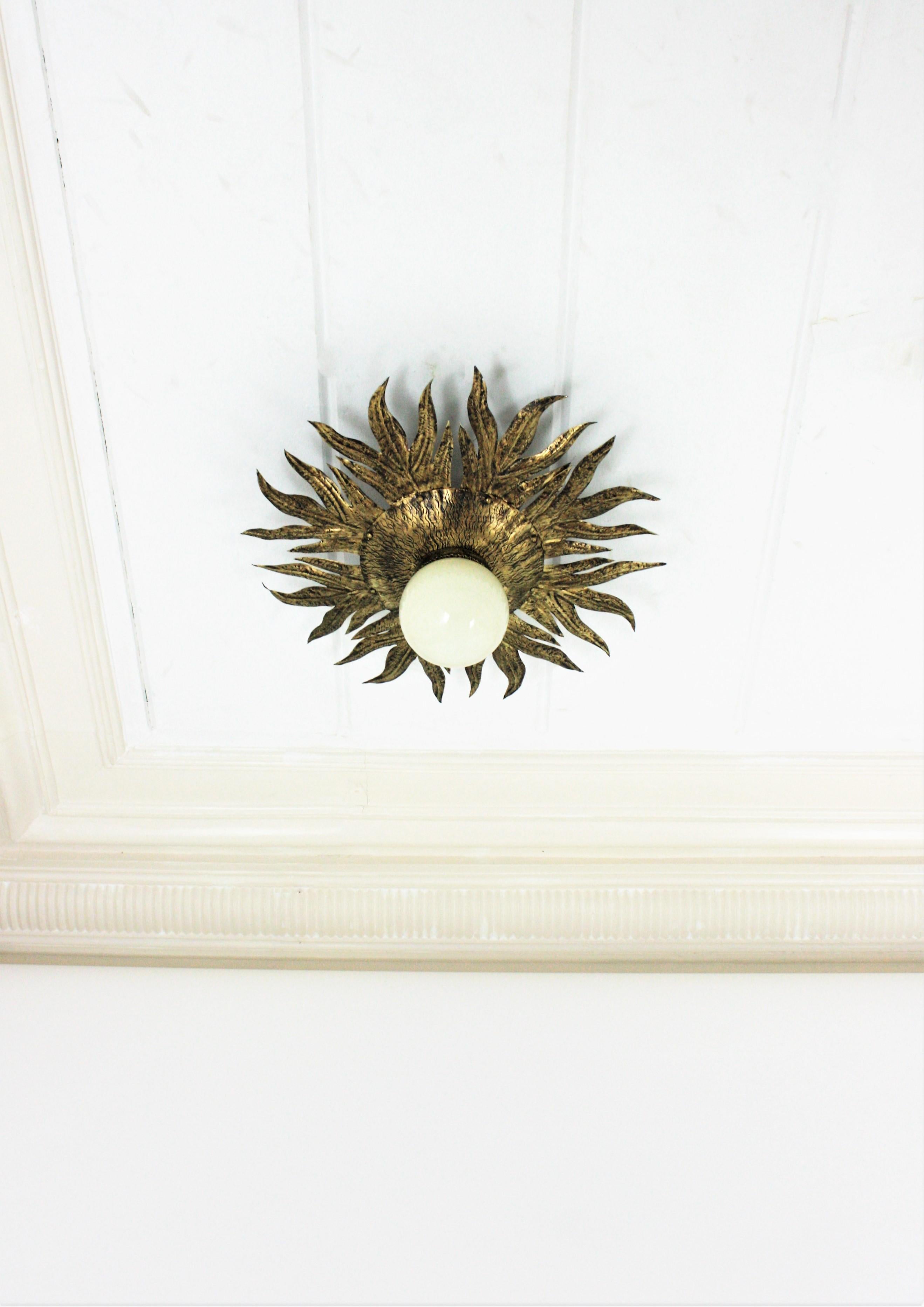 Sunburst Light Fixture in Gilt Metal and Milk Glass In Good Condition For Sale In Barcelona, ES