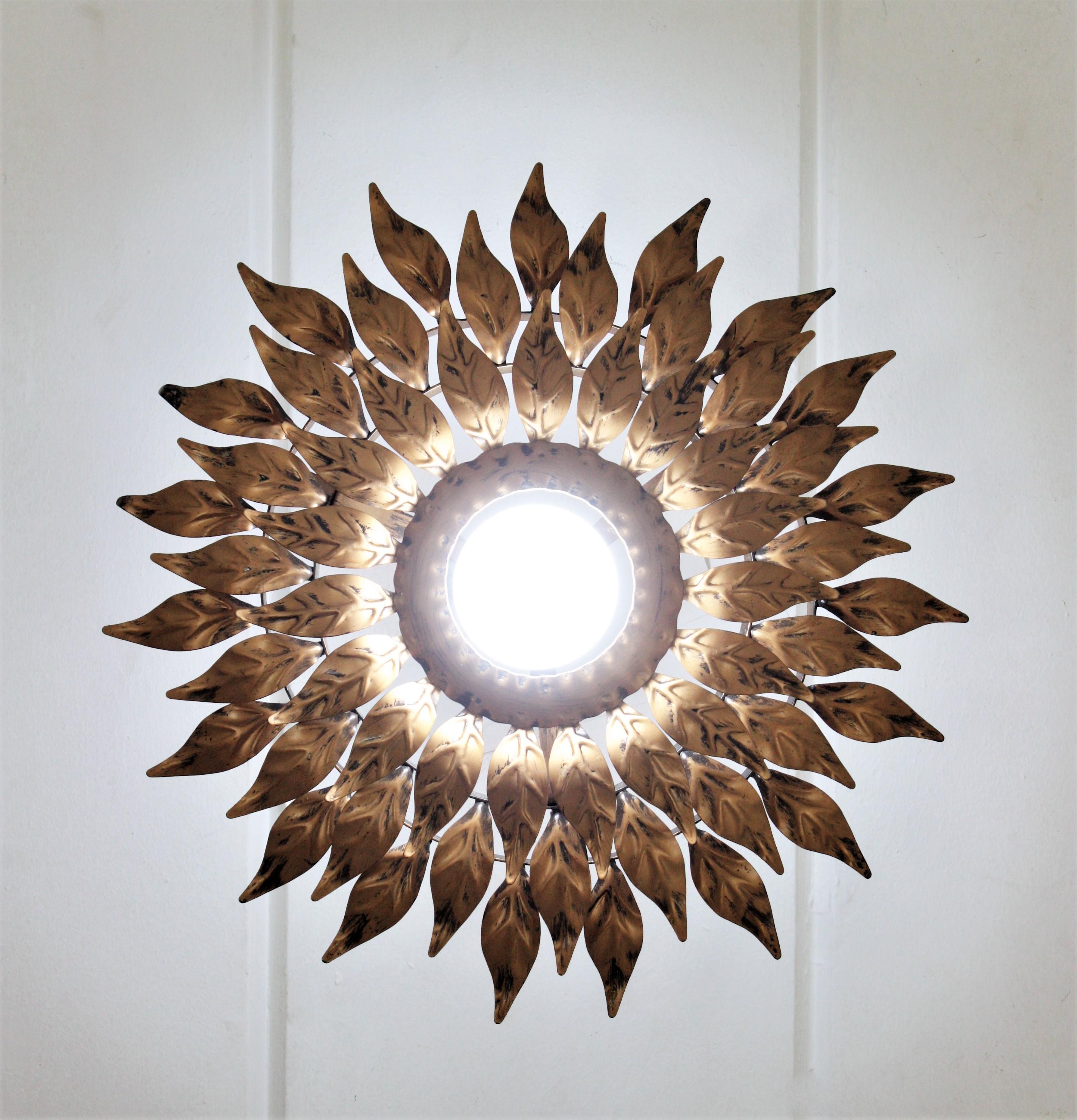 Spanish Sunburst Flower Leafed Light Fixture in Gilt Metal For Sale