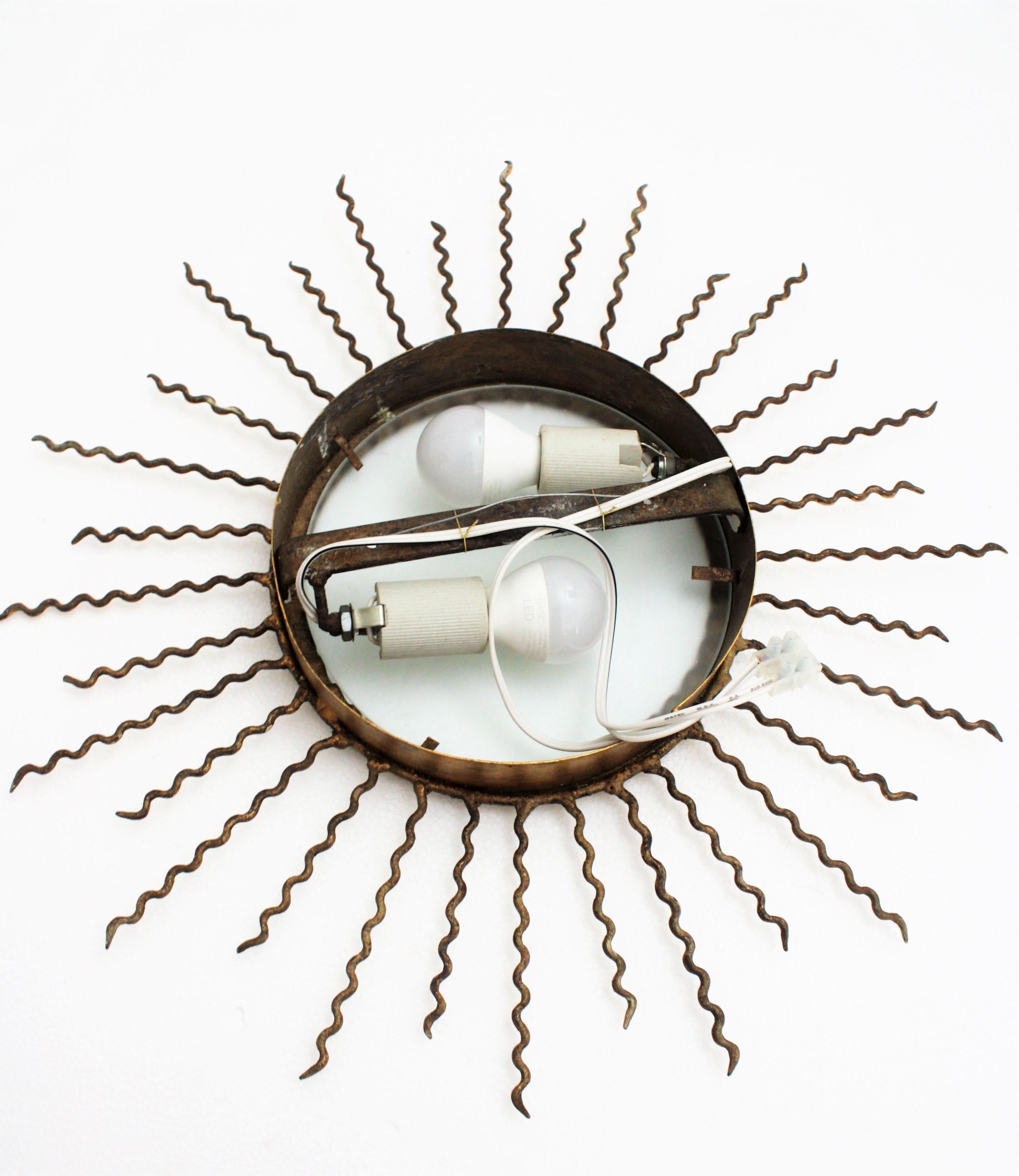 Sunburst Light Fixture or Sunburst Mirror in Gilt Iron, 1950s 10