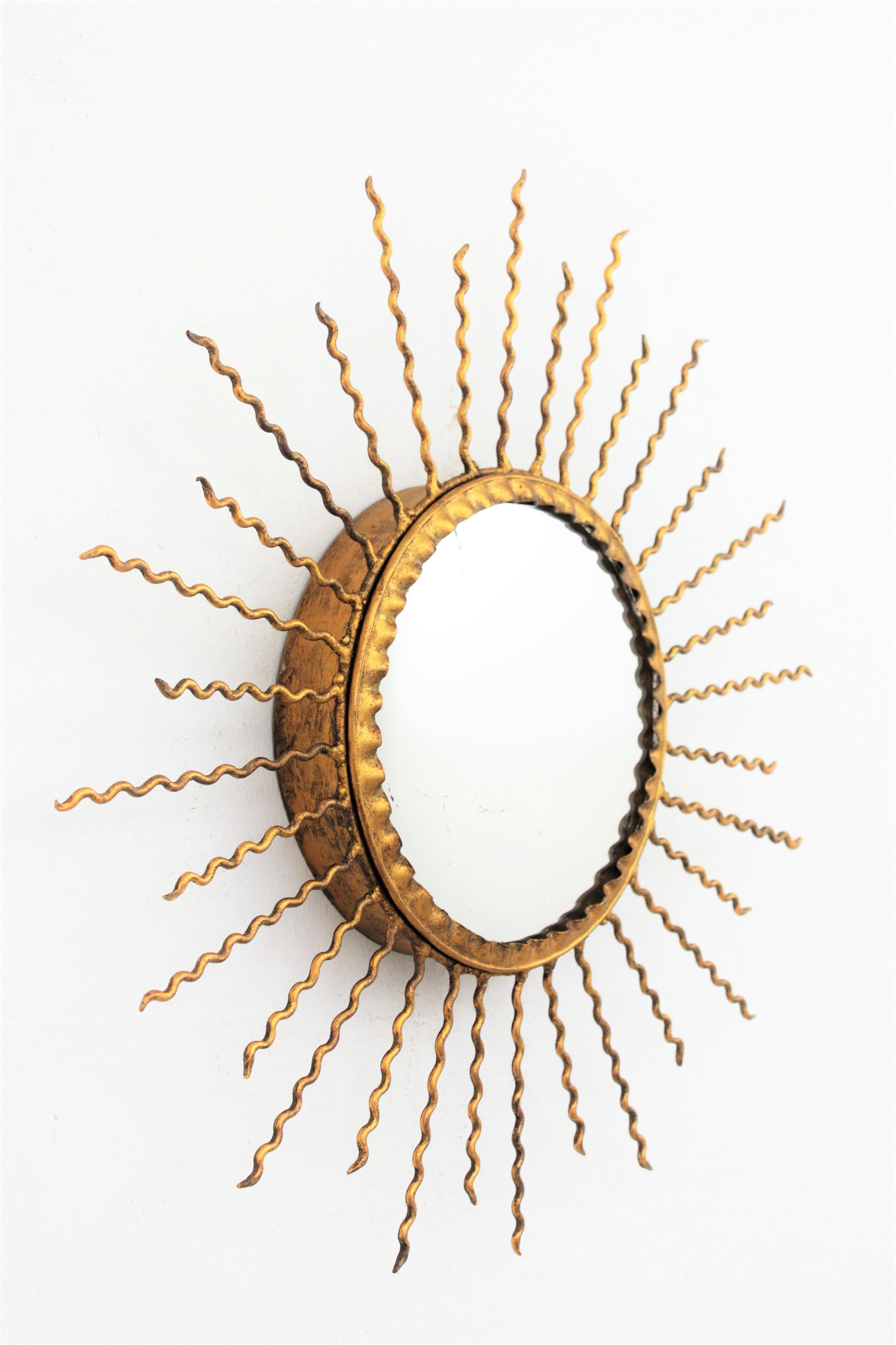 Spanish Sunburst Light Fixture or Sunburst Mirror in Gilt Iron, 1950s
