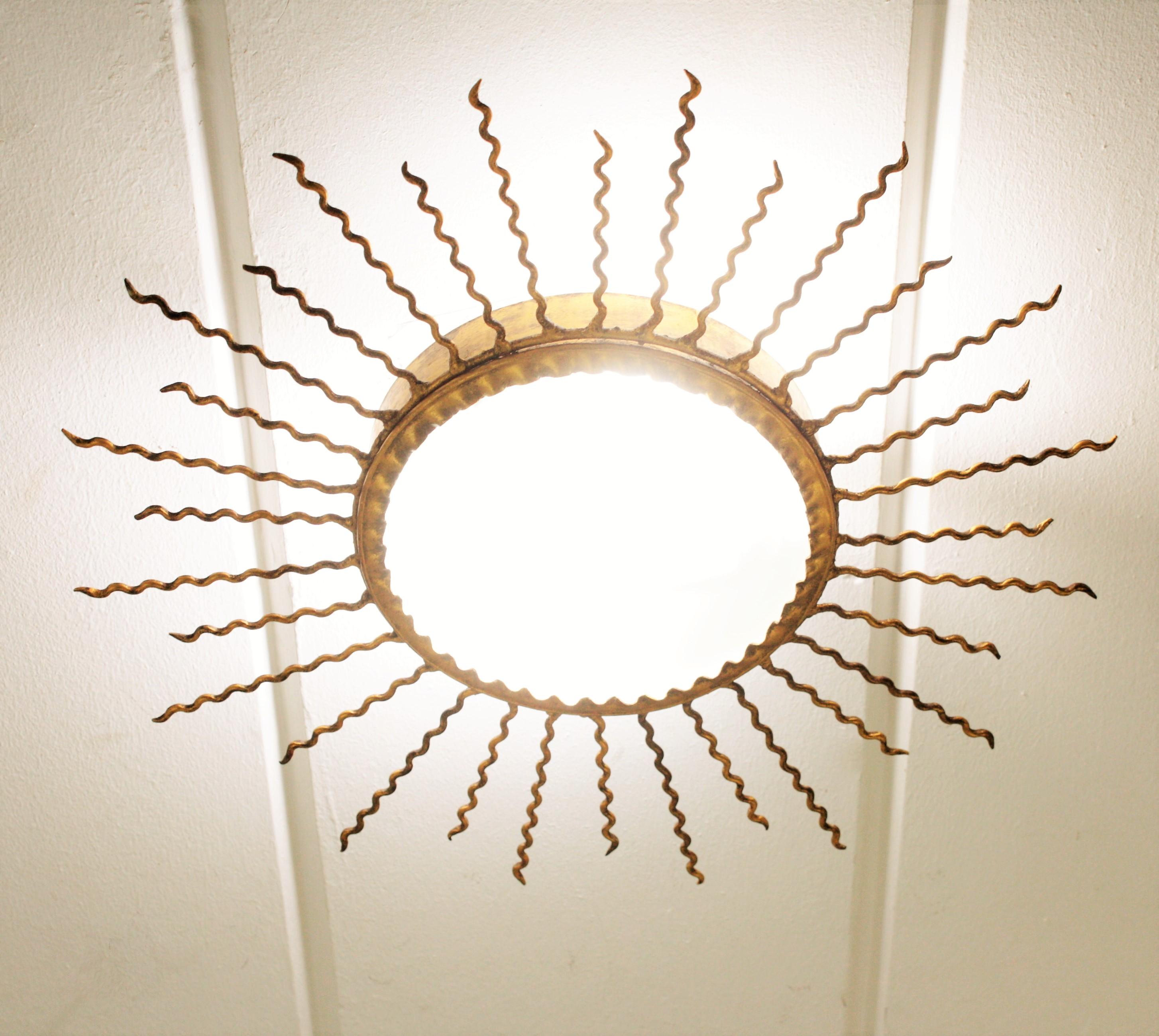 Sunburst Light Fixture or Sunburst Mirror in Gilt Iron, 1950s 2