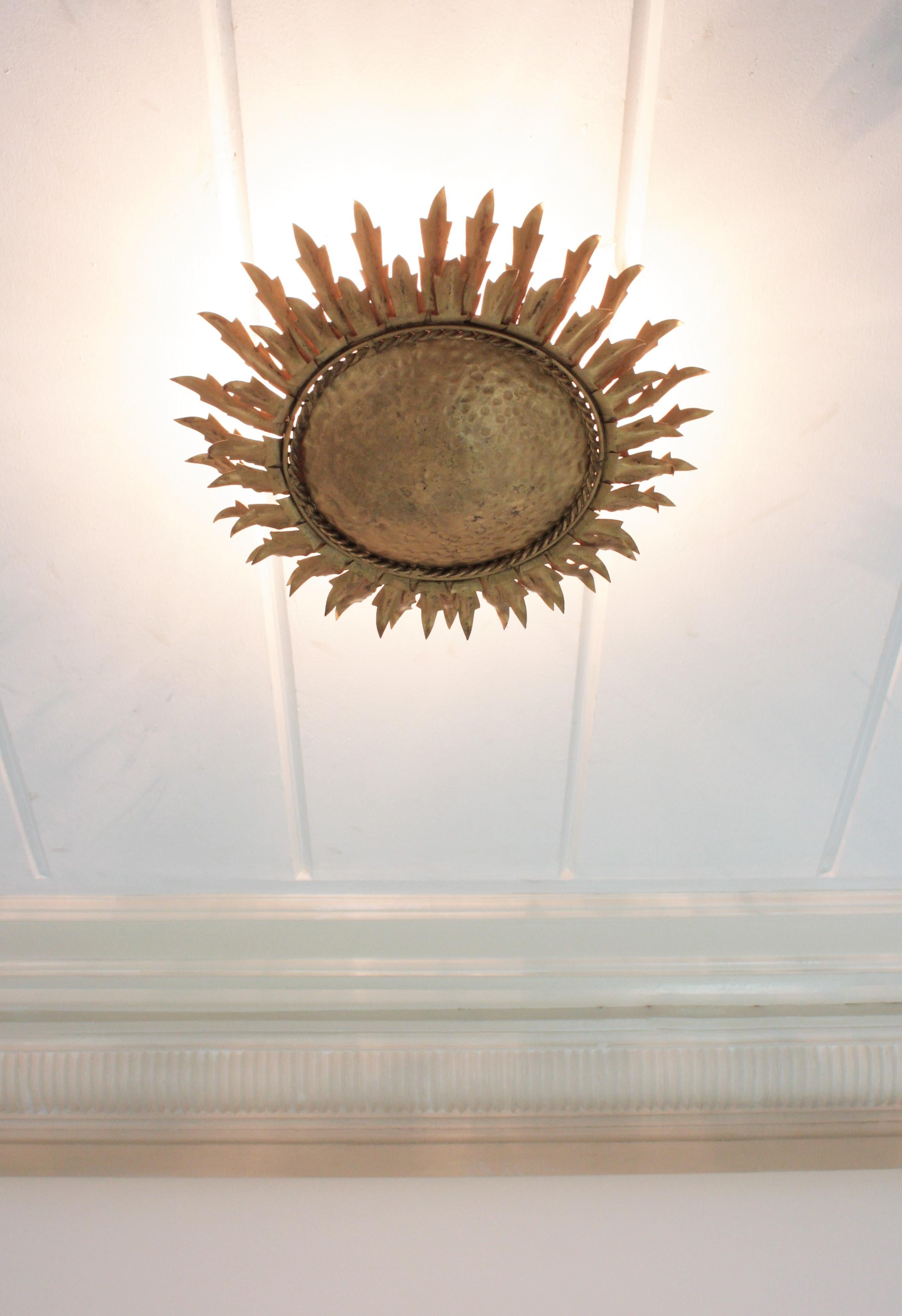 Patinated Sunburst Light Fixture / Wall Sconce in Gilt Metal, 1960s For Sale