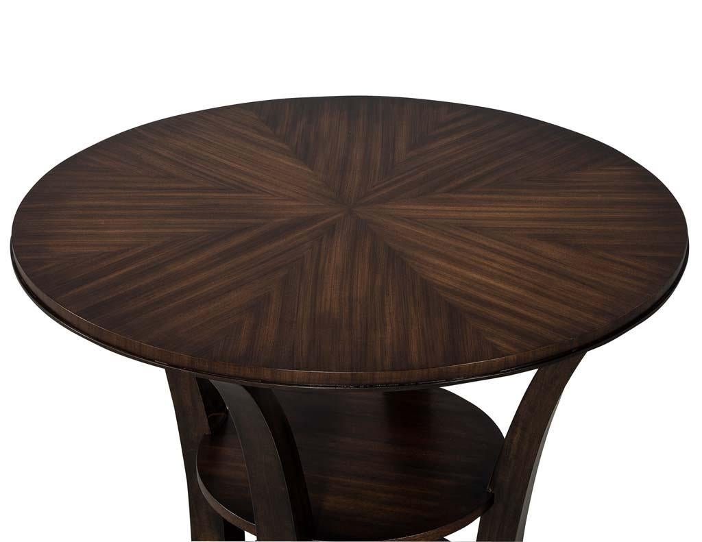 Round occasional sunburst mahogany top table. It has been finished in a rich brown satin, hand applied finish by Carrocel. This table is a classic design that fits a multitude of interior design styles. Its size is perfect for a grand living room or