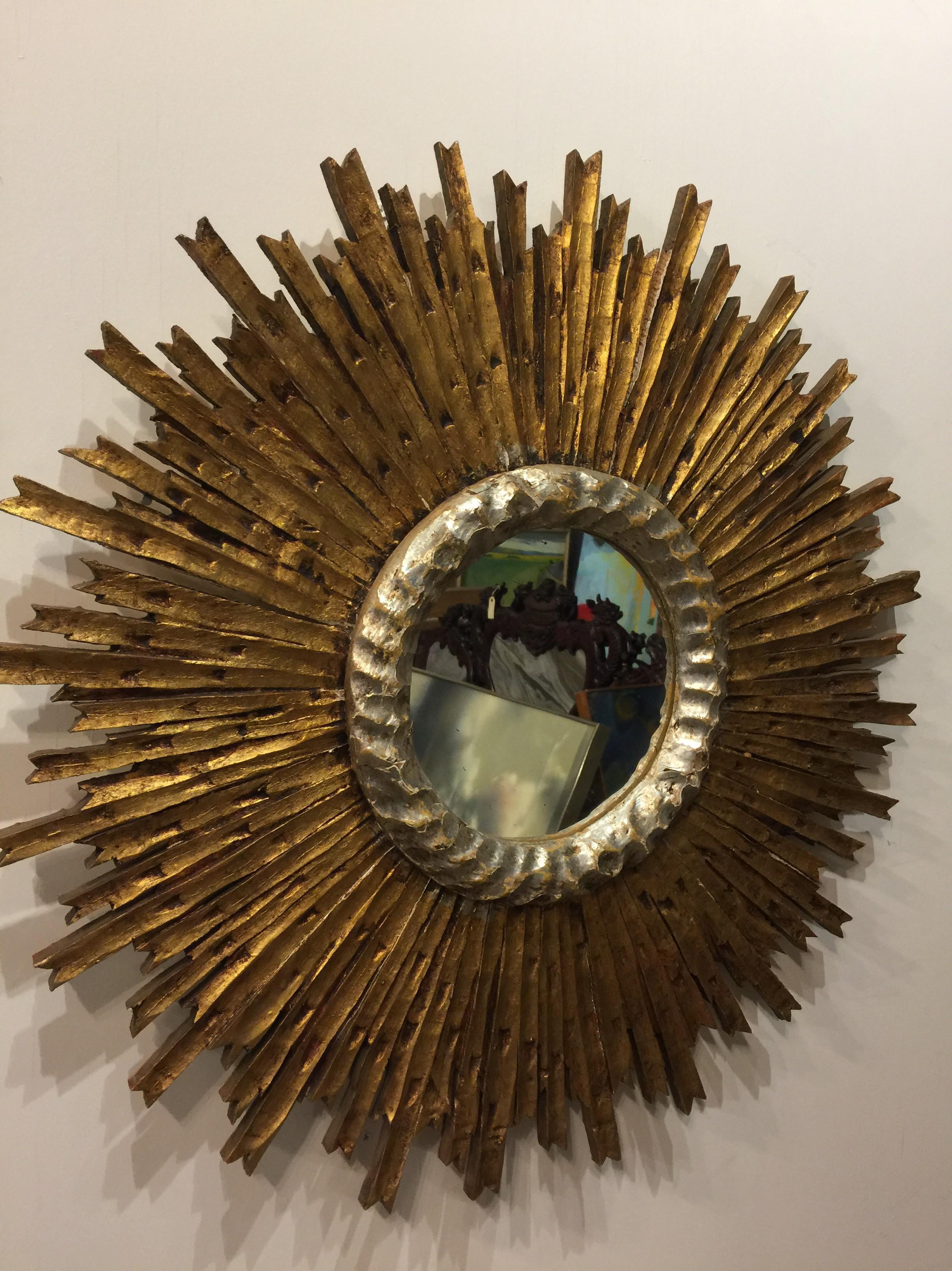 French wood carved silver leaf gold finished sunburst mirror.