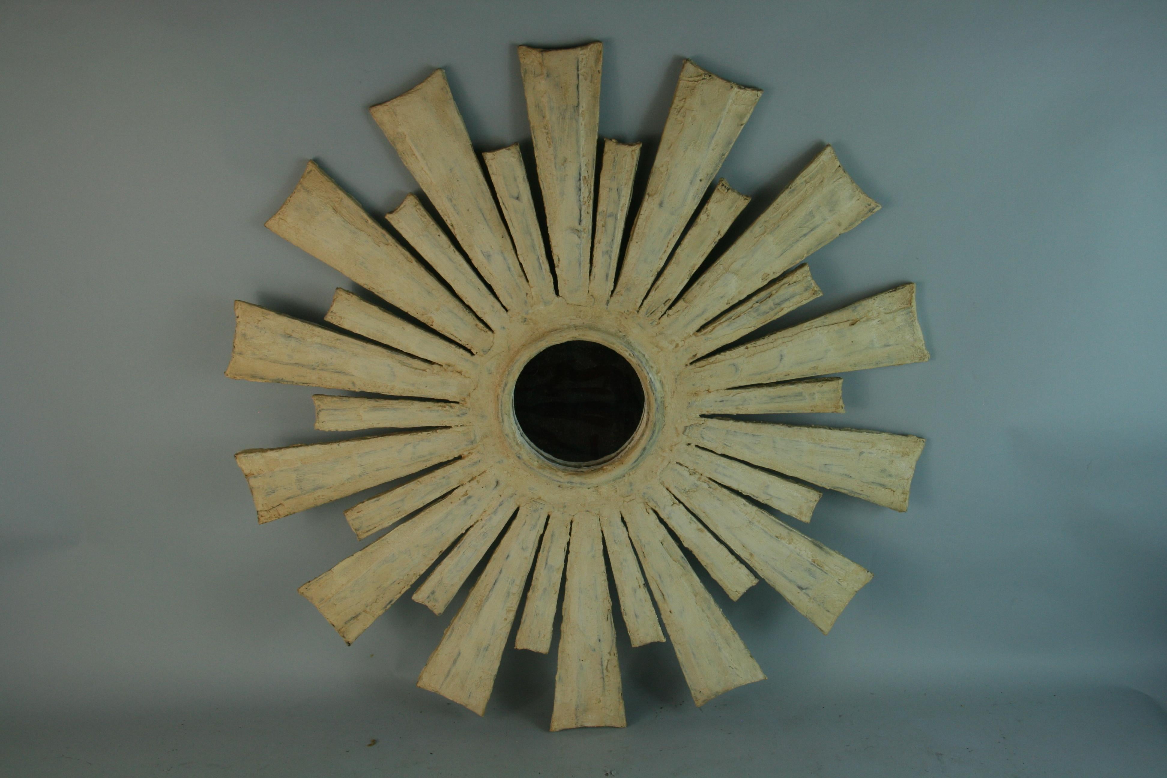 1504
Hand made wood starburst mirror covered in plaster