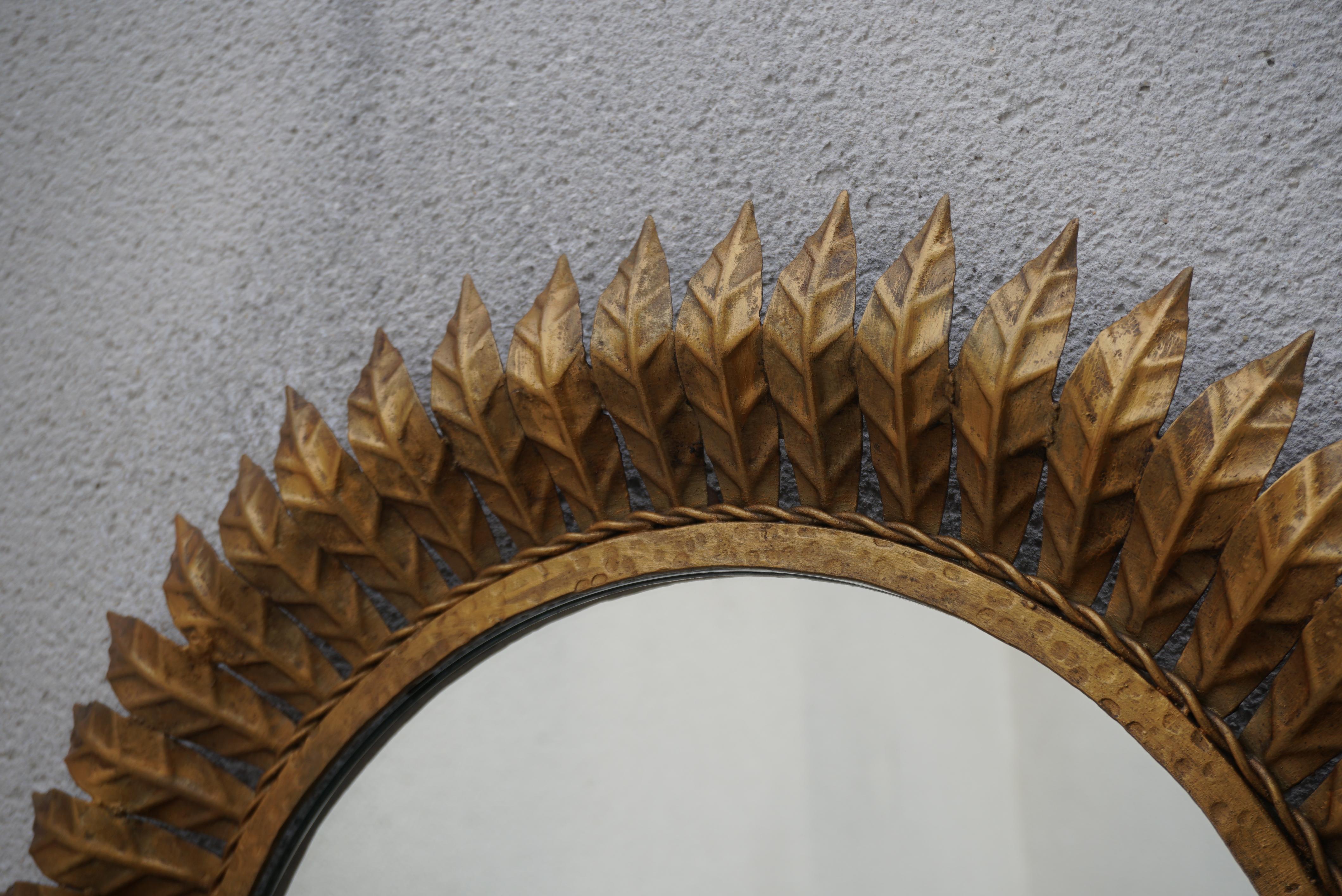 Hollywood Regency Sunburst Mirror, Framed with Gold-colored Metal Leaves, Italy 1970 For Sale
