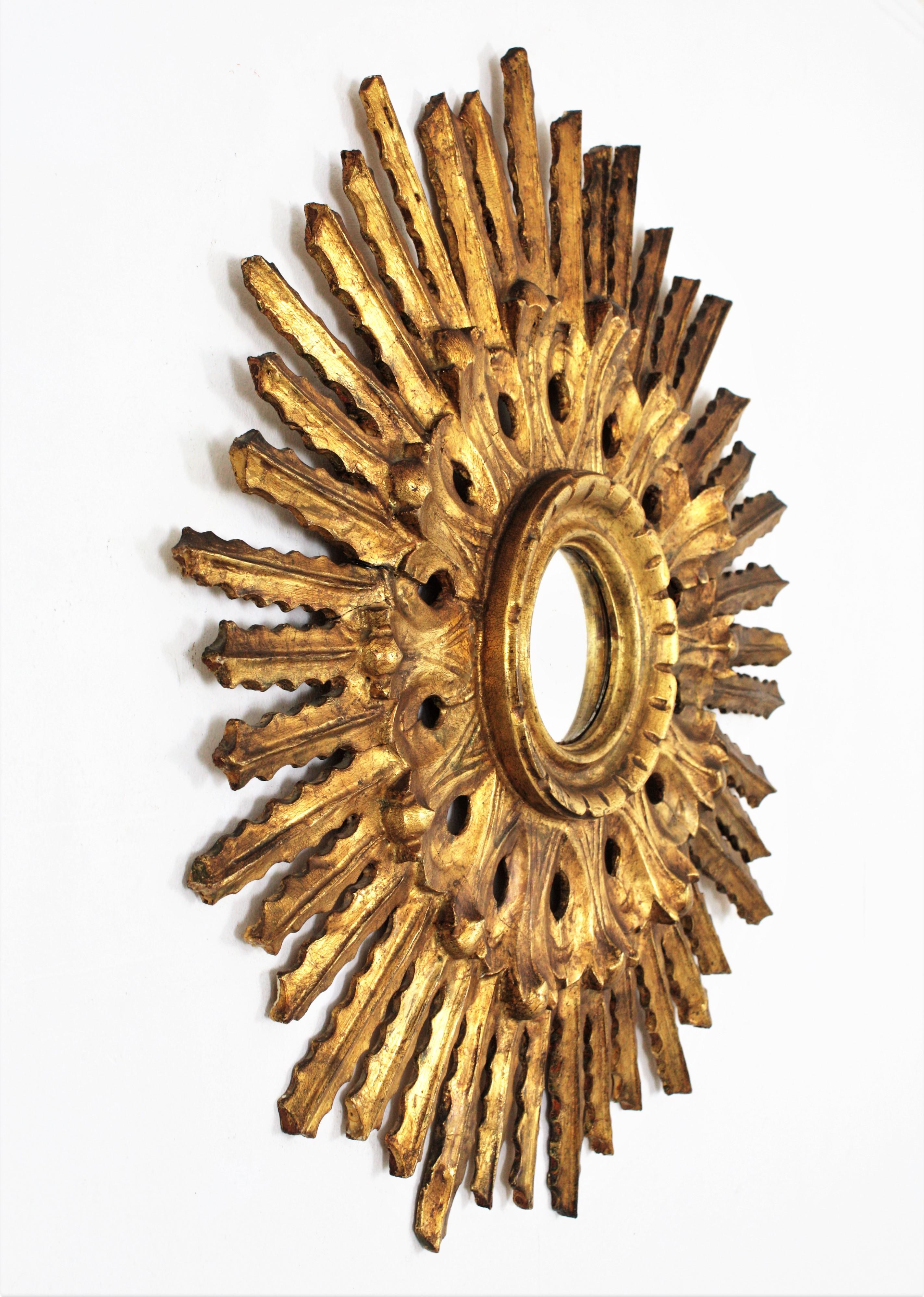 Spanish Sunburst Mirror in Carved Gold Leaf Giltwood and Baroque Style, Spain, 1920s