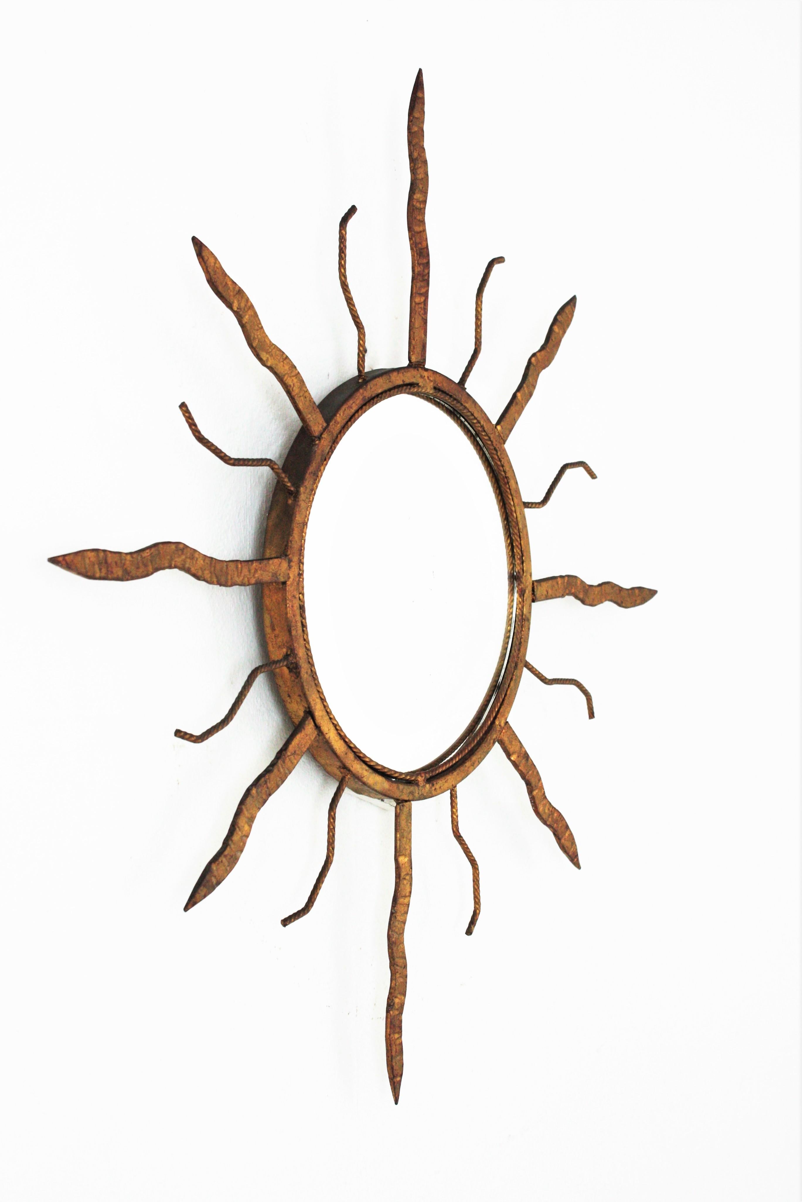 Mid-Century Modern Sunburst Mirror in Gilt Iron in the Style of Poillerat