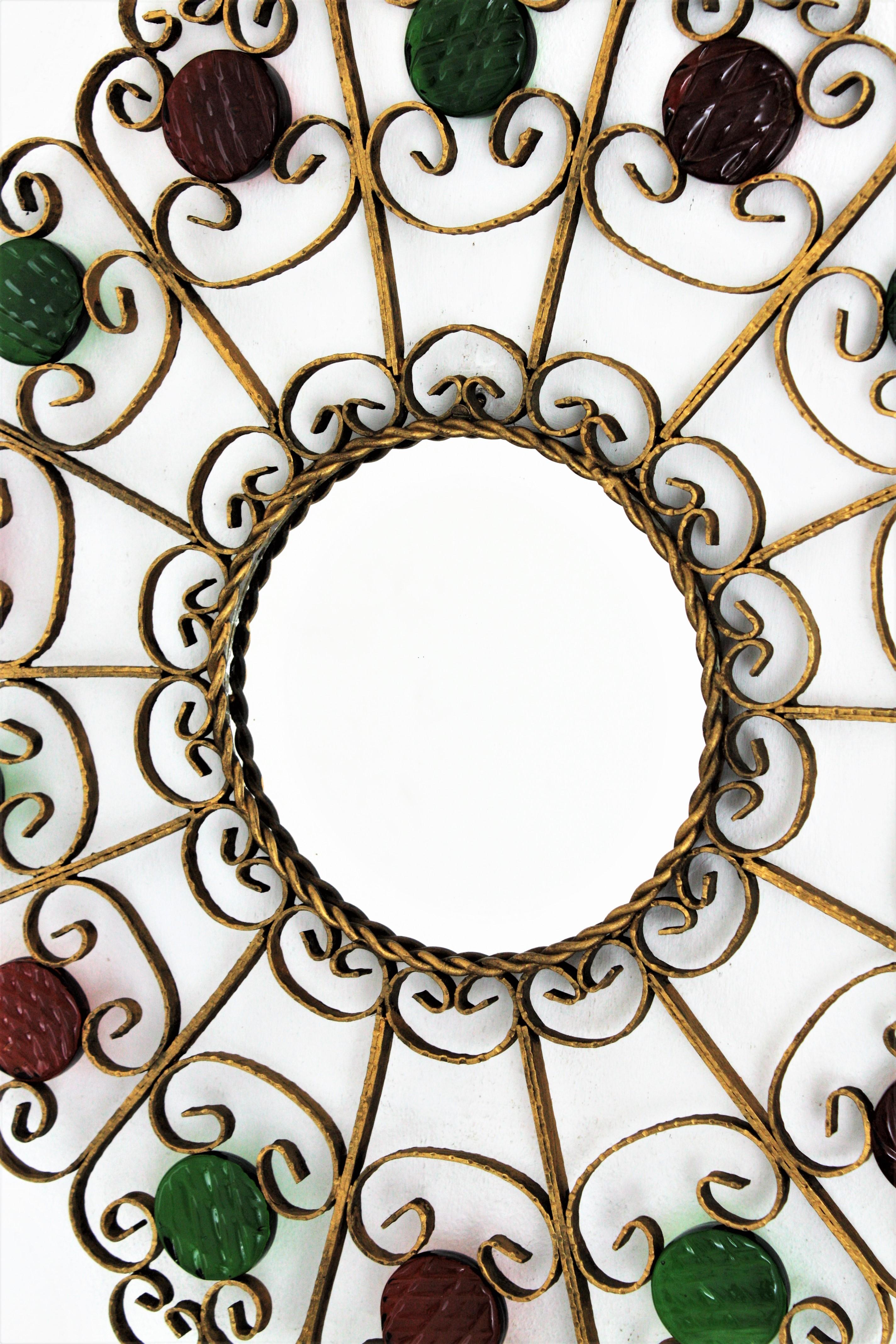 Sunburst Mirror in Gilt Metal and Red and Green Glass In Good Condition For Sale In Barcelona, ES