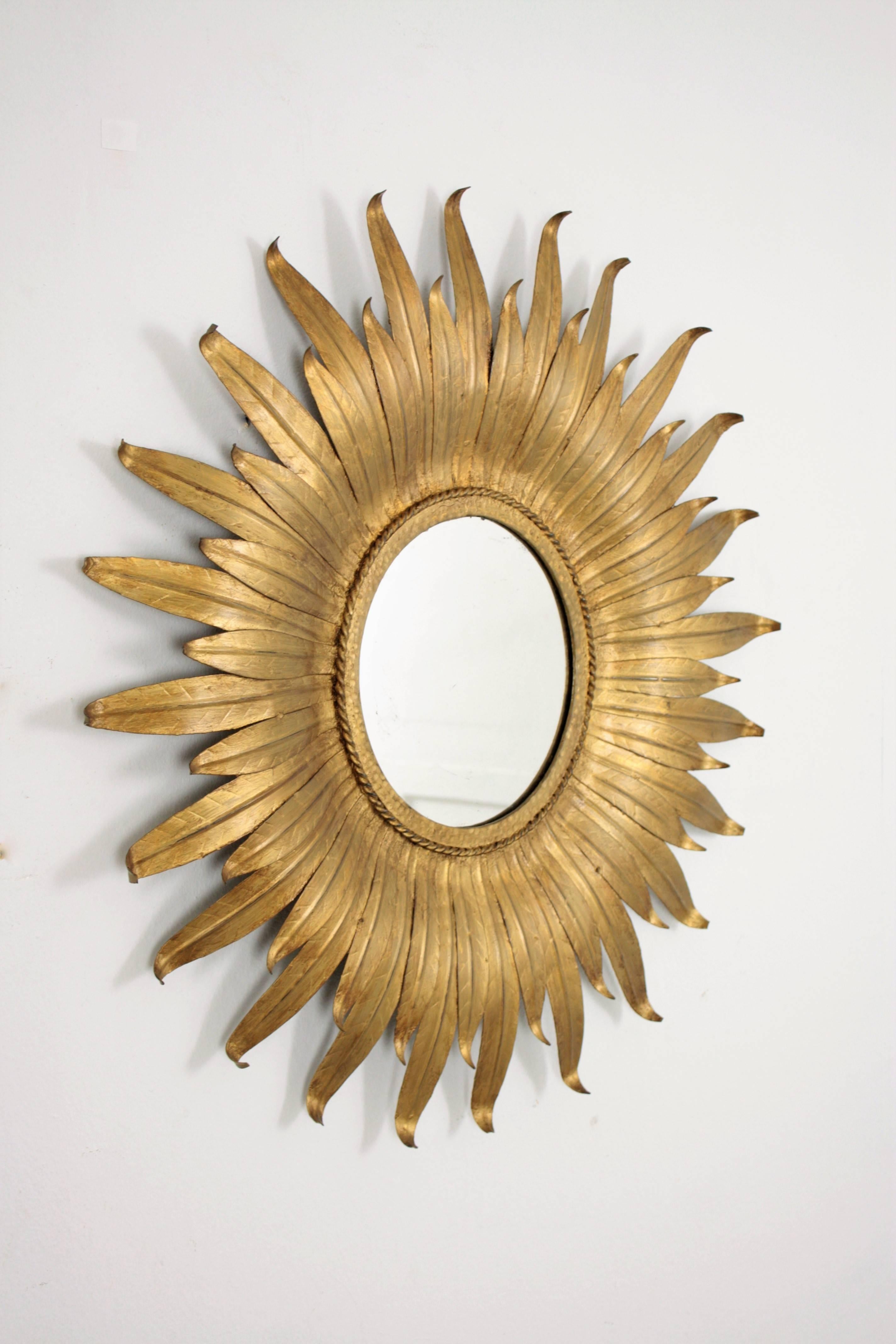 Patinated Spanish Sunburst Leafed Mirror in Gilt Metal