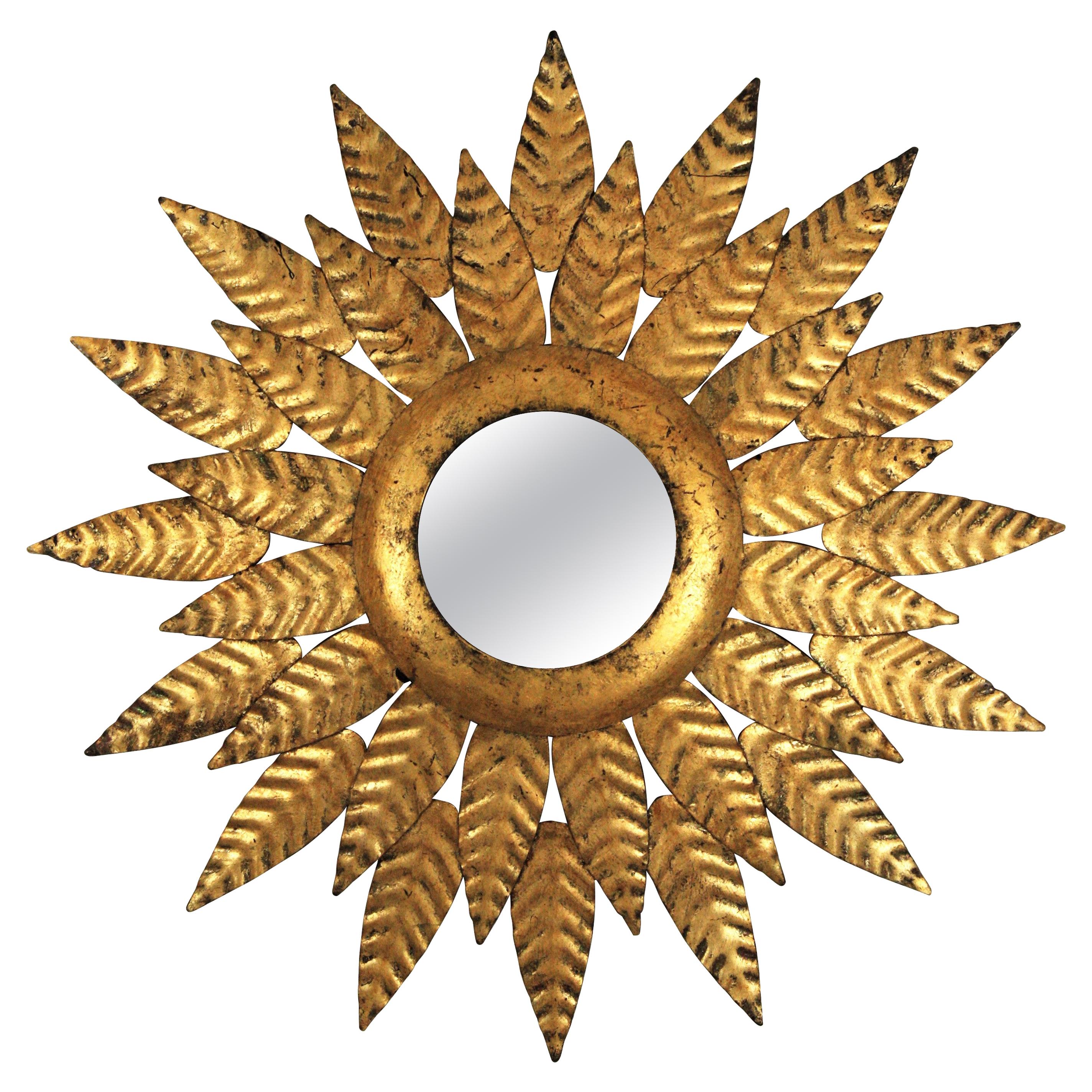 Hollywood Regency Sunburst Mirror in Gilt Iron For Sale