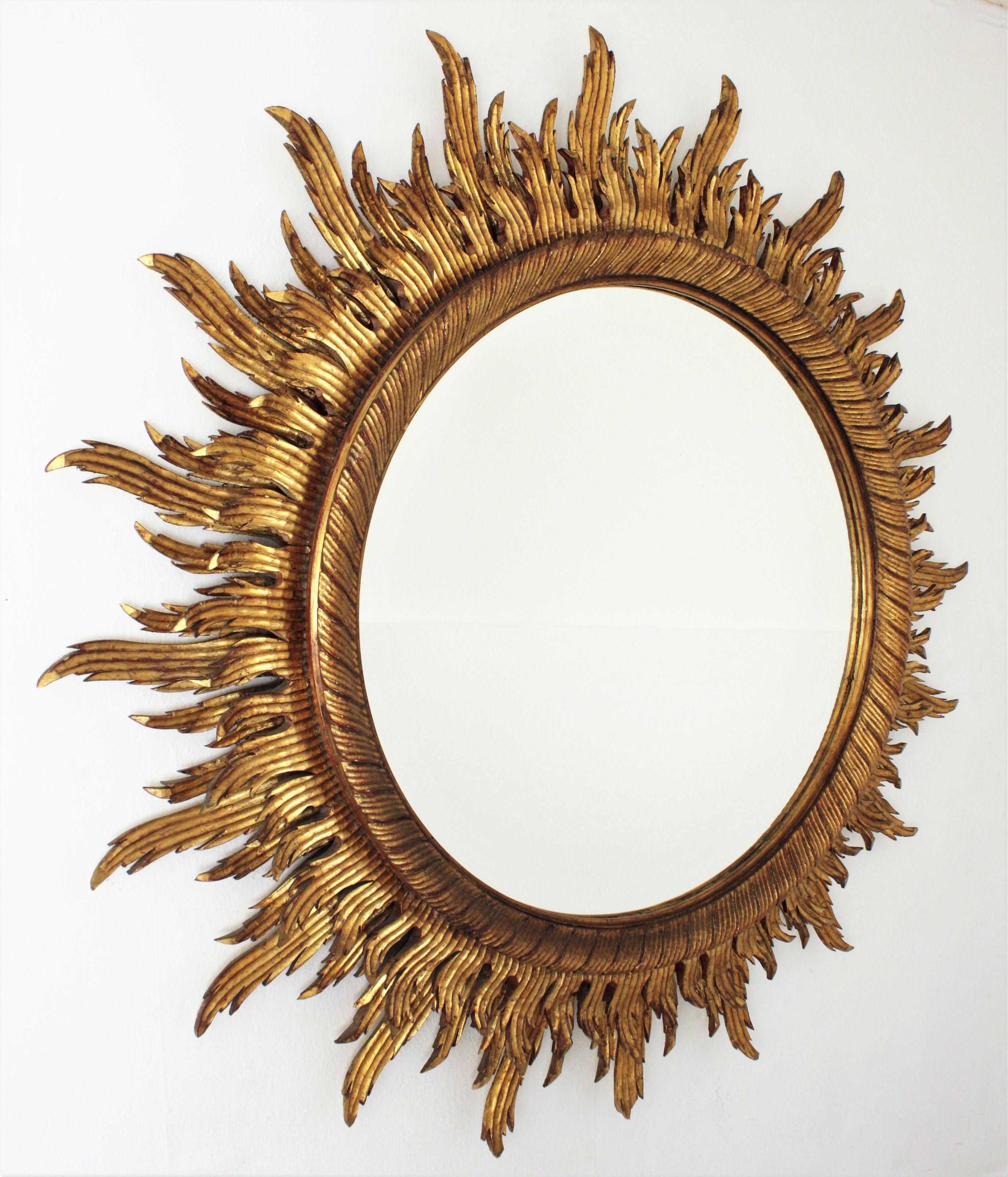 Baroque Oversized Gilt Sunburst Mirror in Carved Wood, 52 inches For Sale