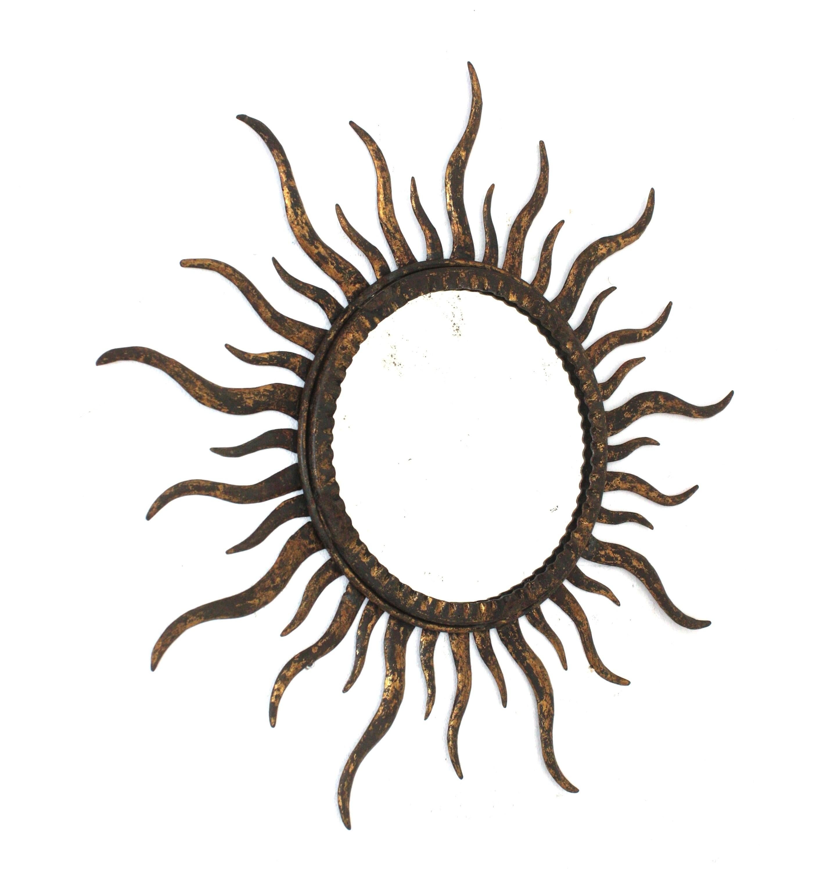 Brutalist Sunburst Mirror in the Style of Gilbert Poillerat, Gilt Metal For Sale