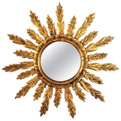 Sunburst Mirror with Leafed Frame in Carved Giltwood