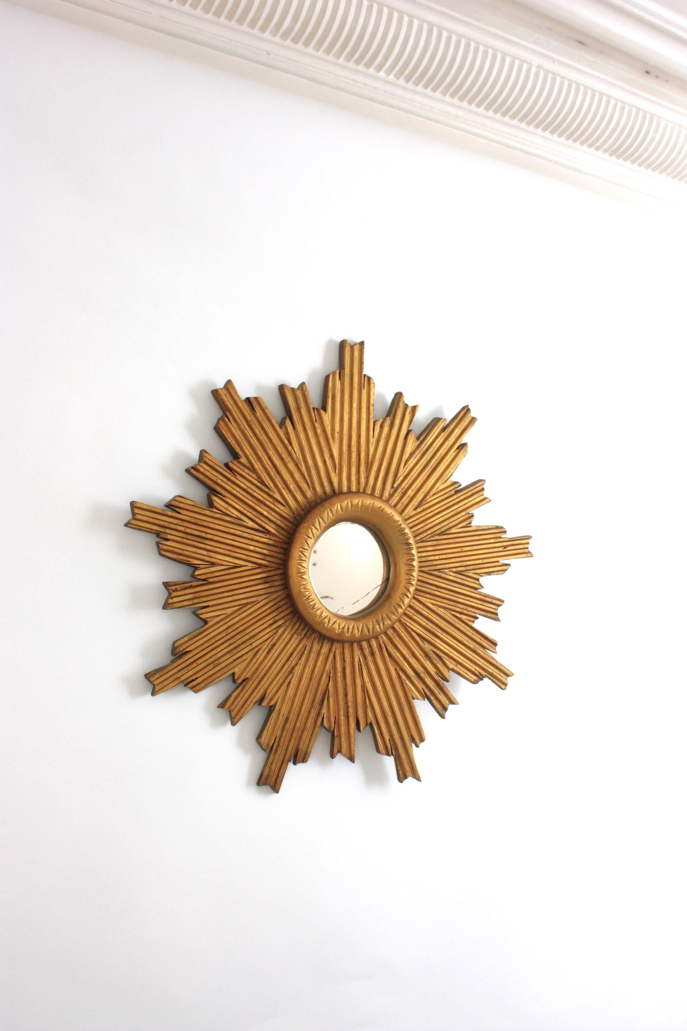 Spanish Sunburst Mirror with Striped Frame in Giltwood For Sale