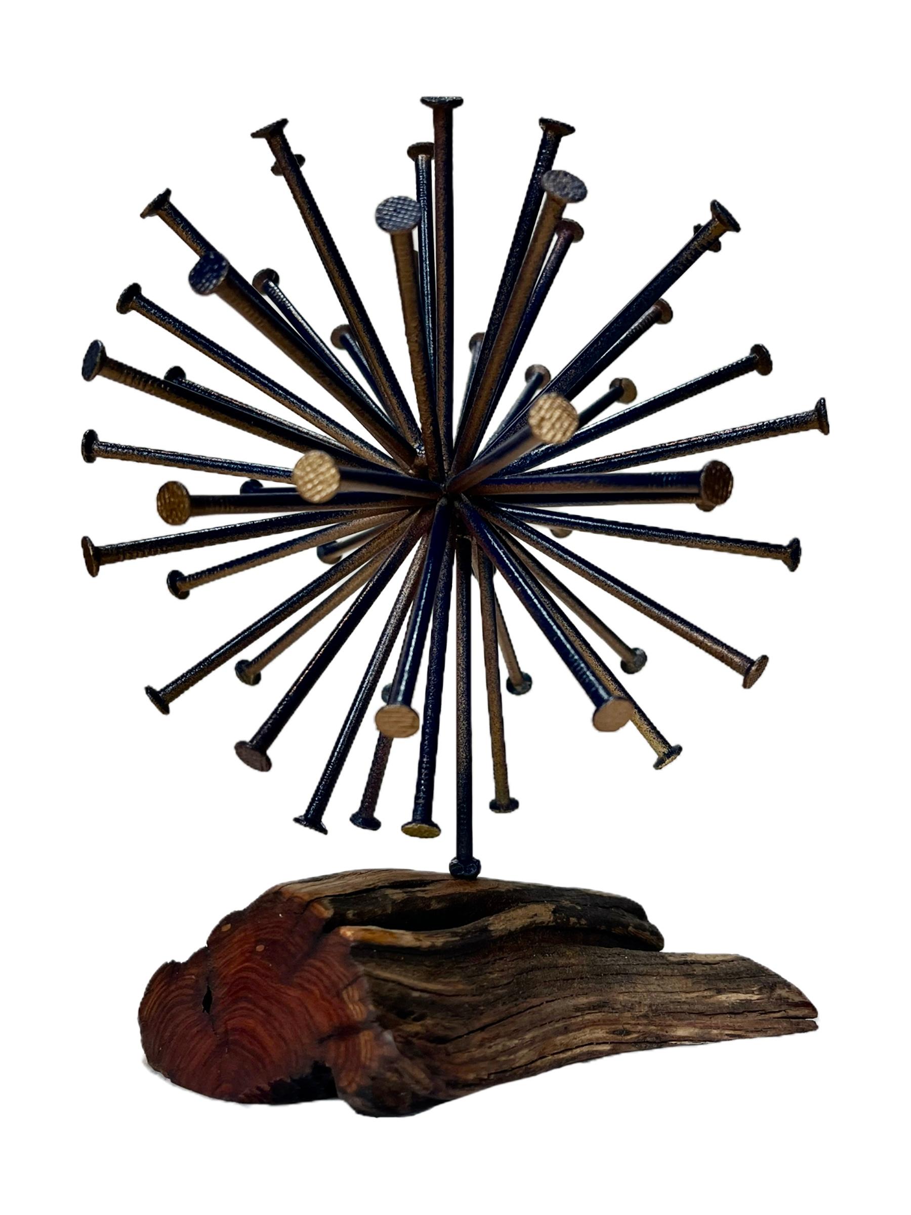Beautiful sphere sculpture created from wood and nails. Signed. Unknown artist.

Measures: 8.5”H x 6”W x 6”D.