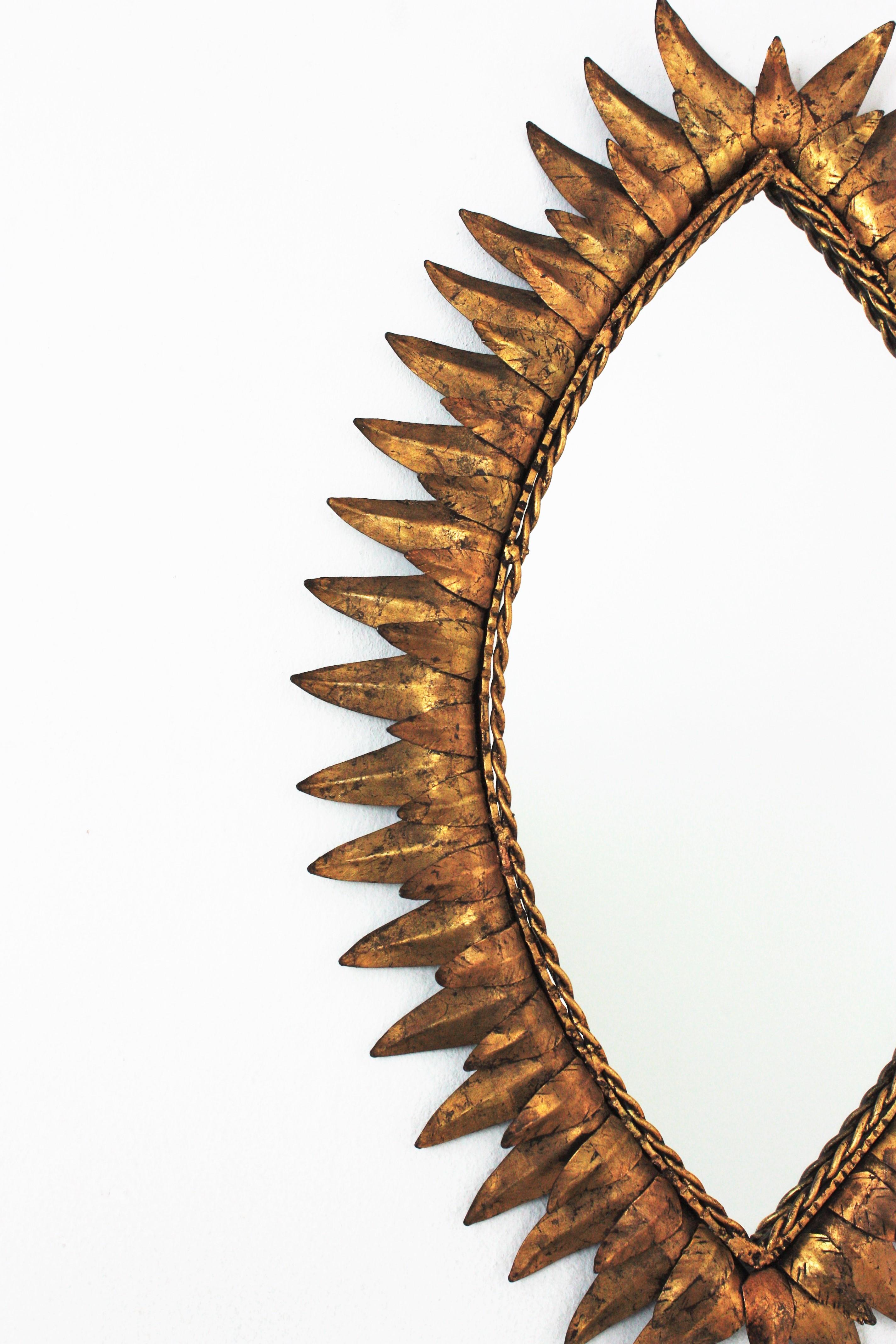 Metal Sunburst Oval Eye Shaped Mirror in Gilt Iron For Sale