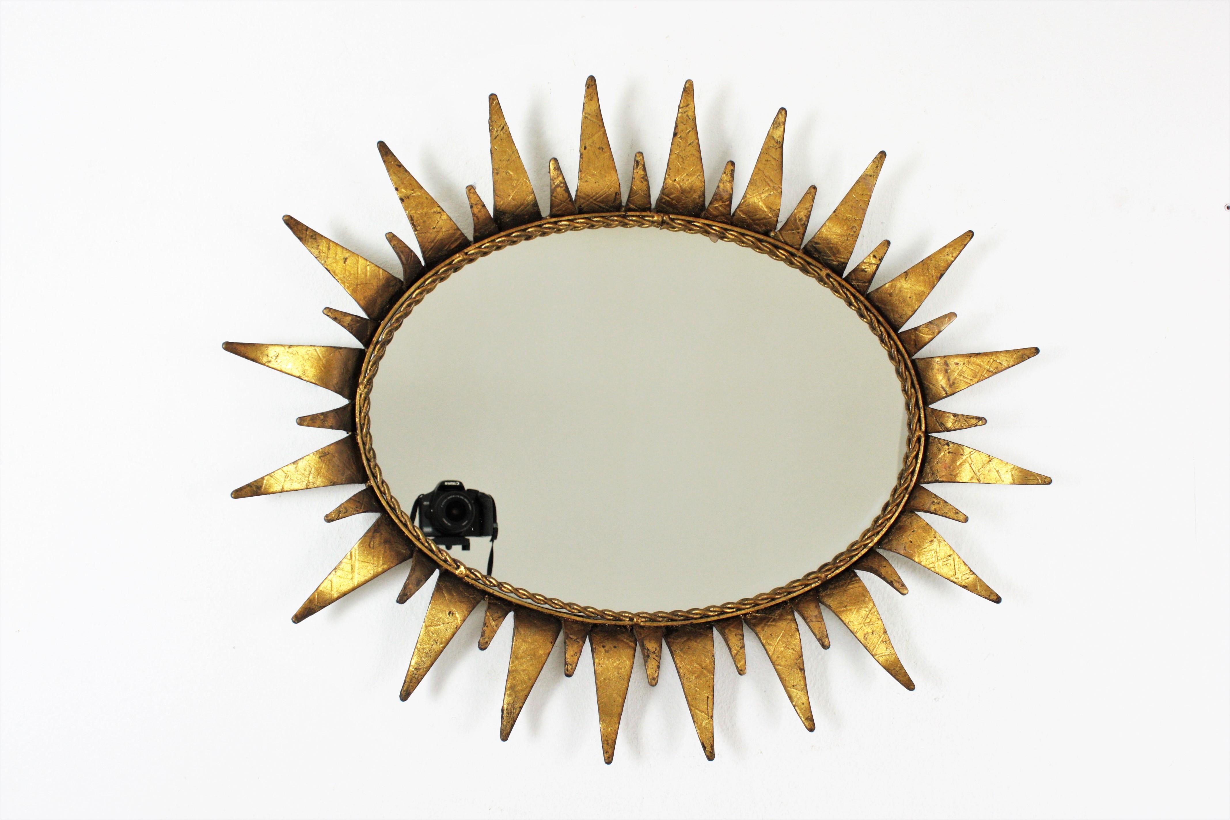 Mid-Century Modern Sunburst Oval Mirror in Gilt Iron