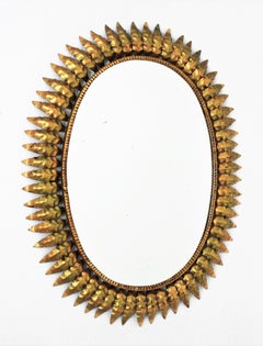 Spanish Sunburst Oval Mirror in Gilt Iron, 1950s