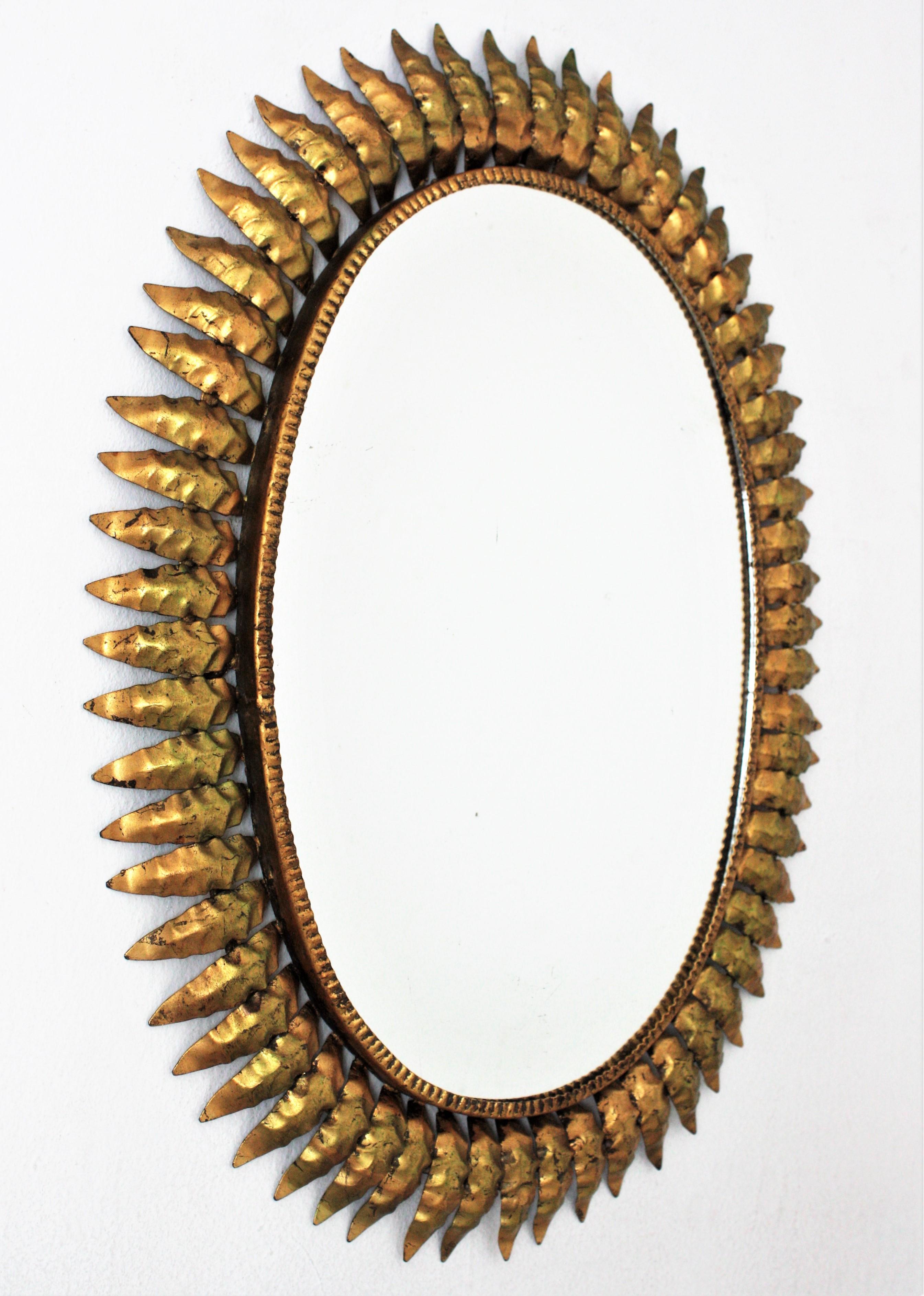 20th Century Spanish Sunburst Oval Mirror in Gilt Iron, 1950s For Sale