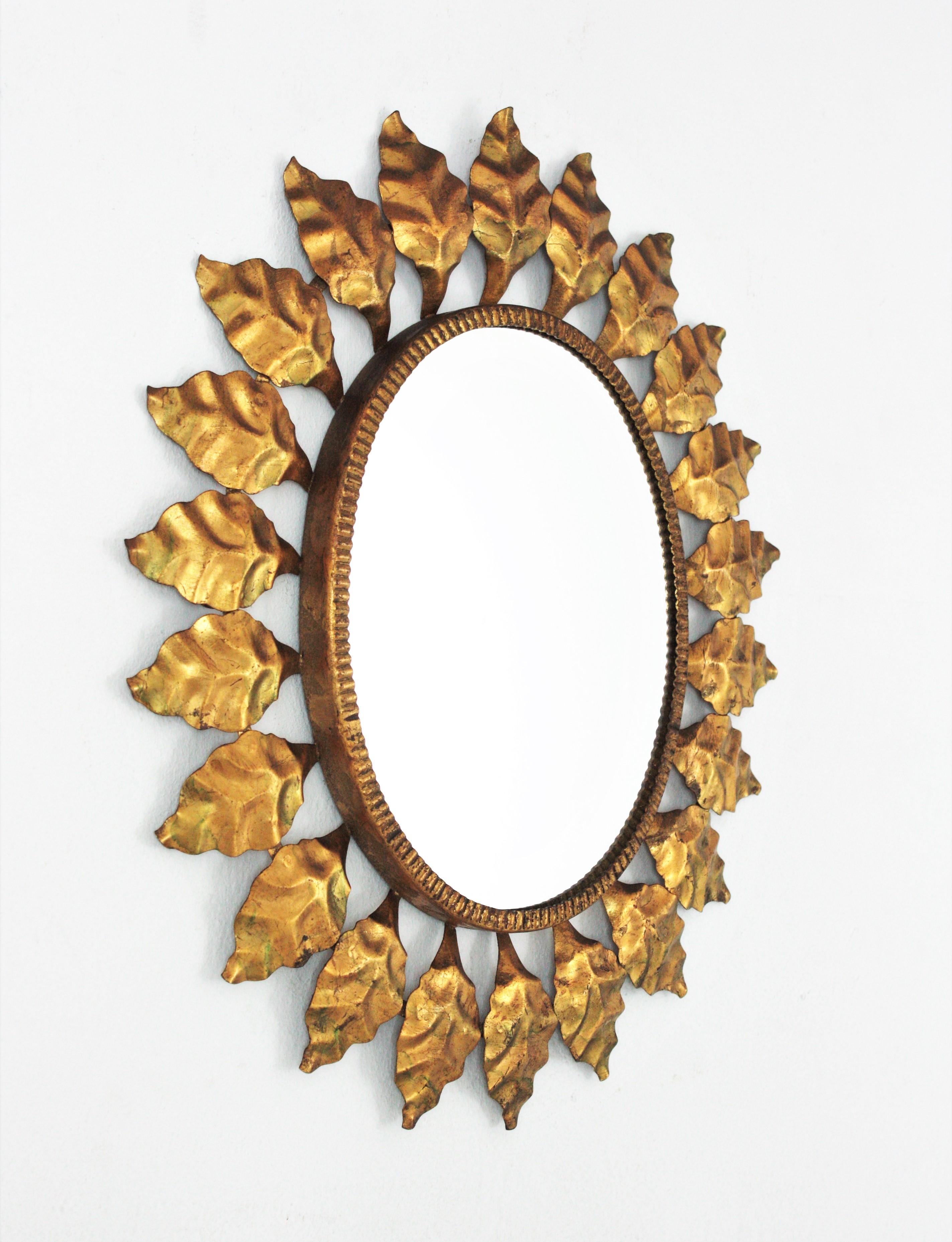 Spanish Sunburst Oval Mirror in Gilt Metal, 1950s For Sale