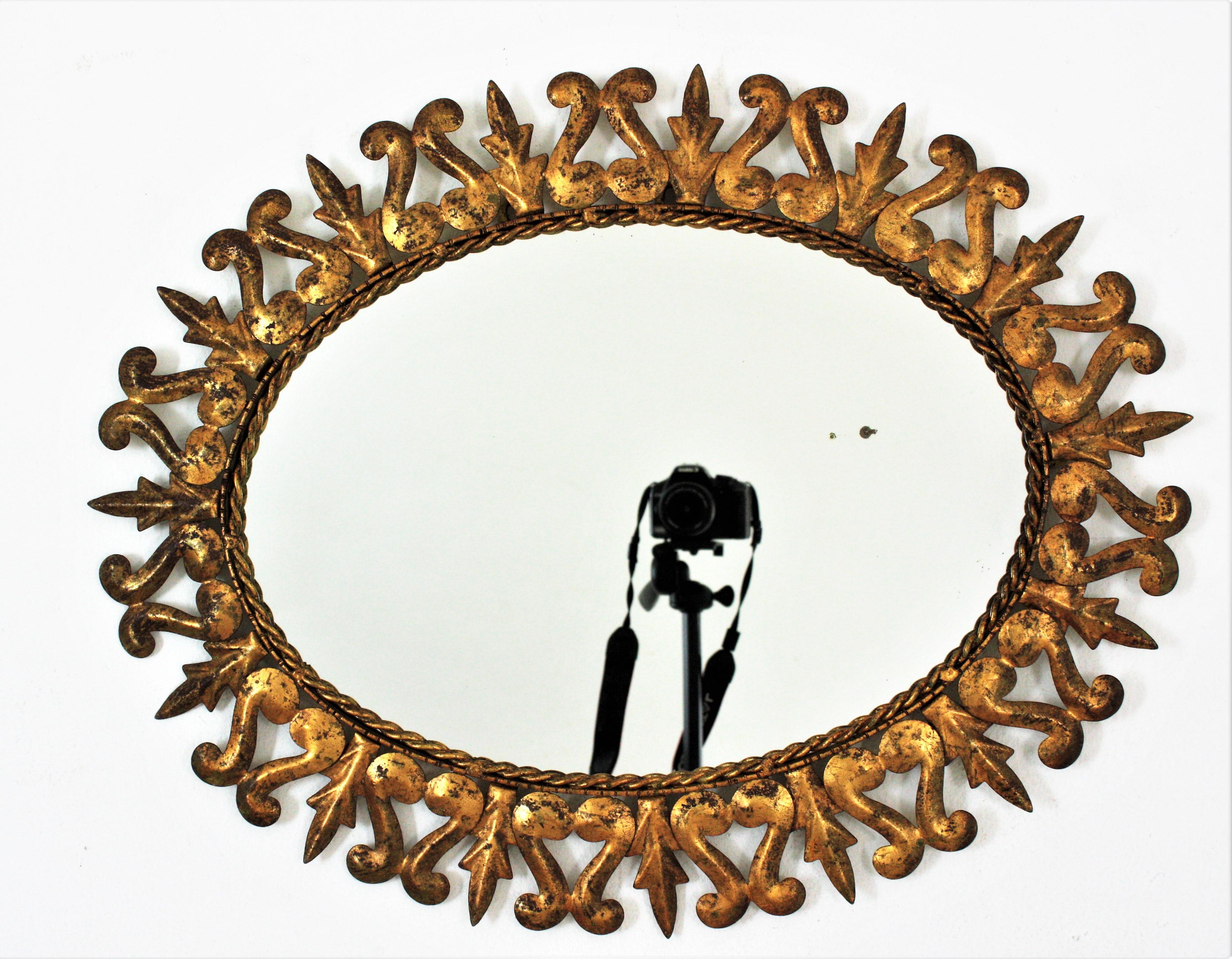 Sunburst Oval Mirror in Gilt Metal, Scroll and Leaf Motif Frame, Spain, 1950s  For Sale 3