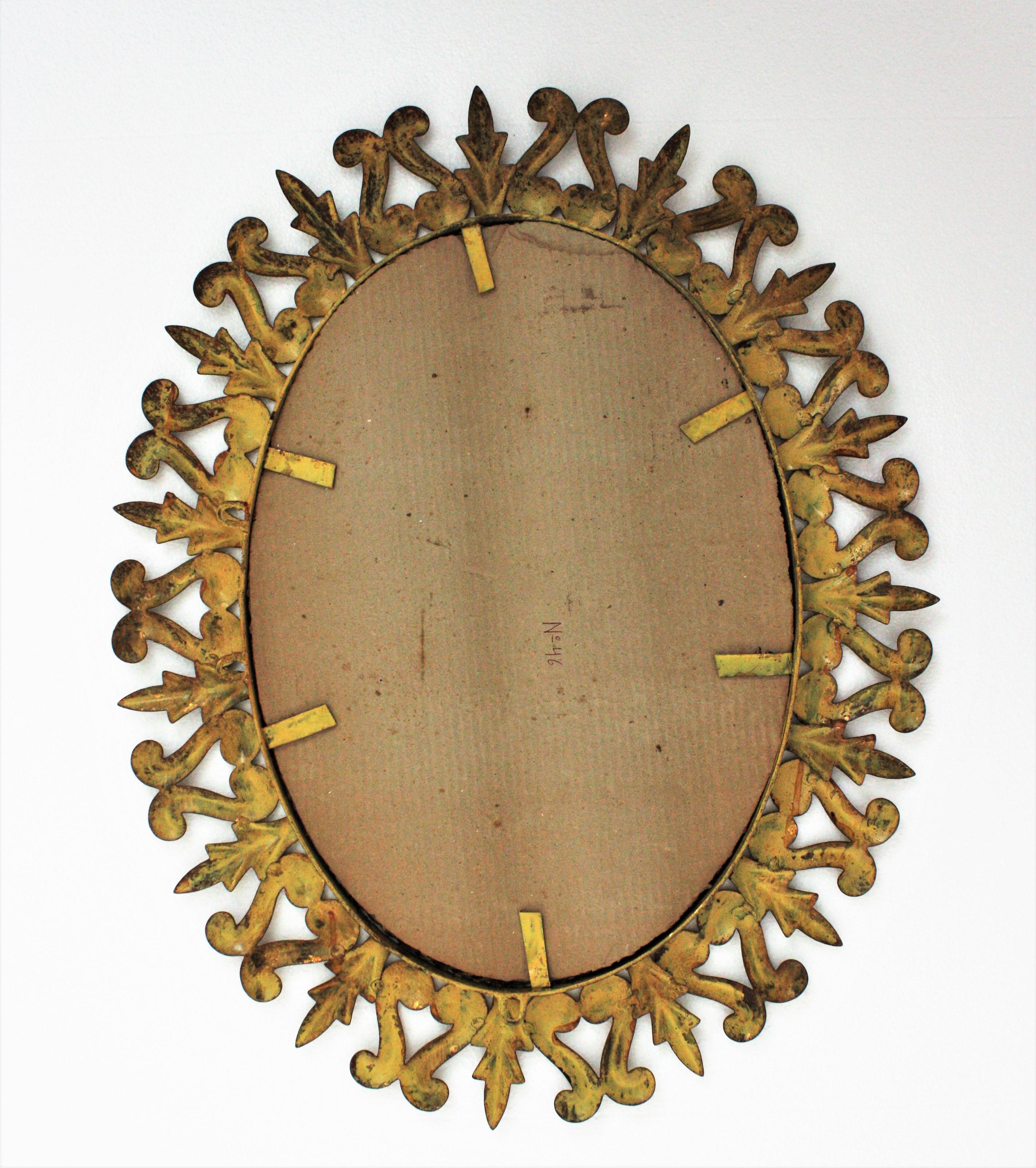 Sunburst Oval Mirror in Gilt Metal, Scroll and Leaf Motif Frame, Spain, 1950s  For Sale 4