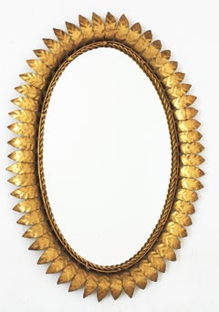 1950er Jahre Ovaler Spiegel mit Sonnenschliff aus vergoldetem Metall
