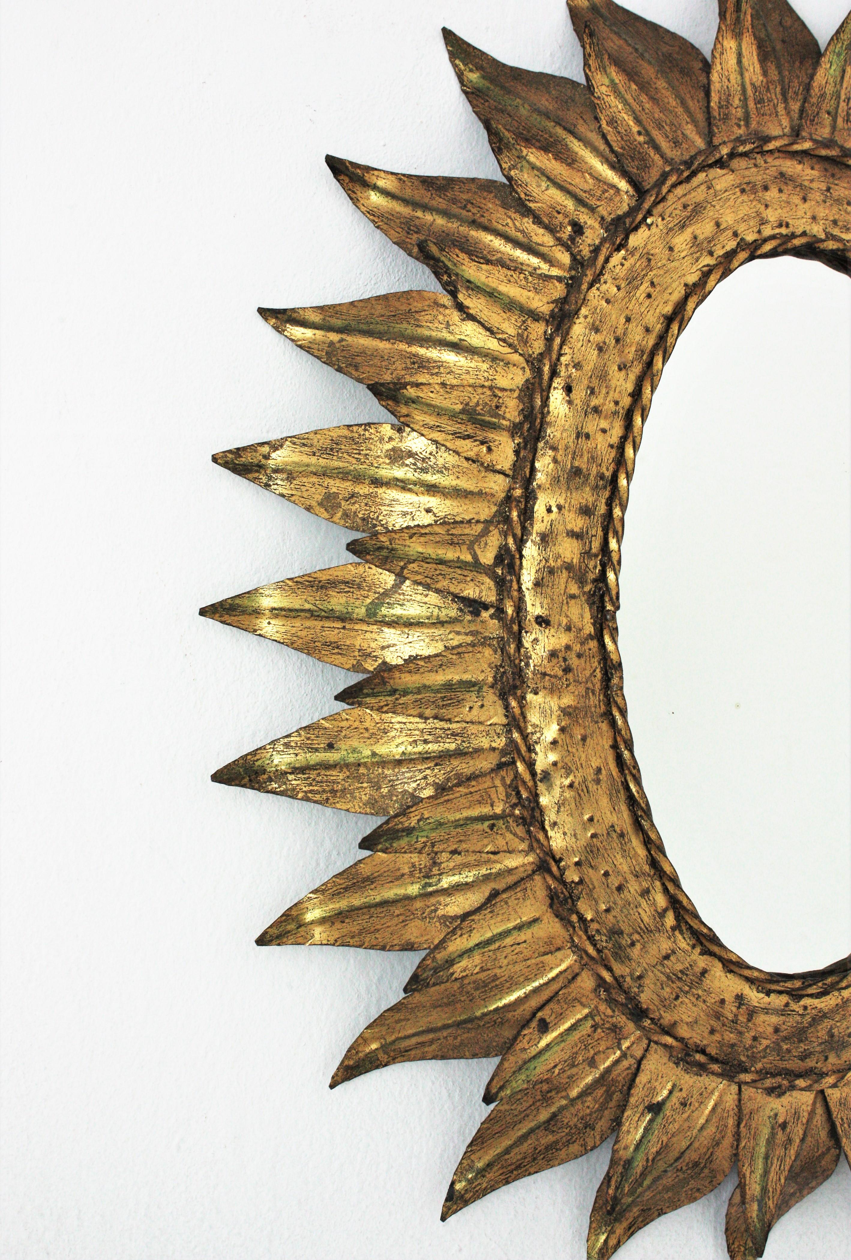 Spanish Sunburst Oval Mirror in Gilt Metal with Double Leafed Frame, France, 1950s