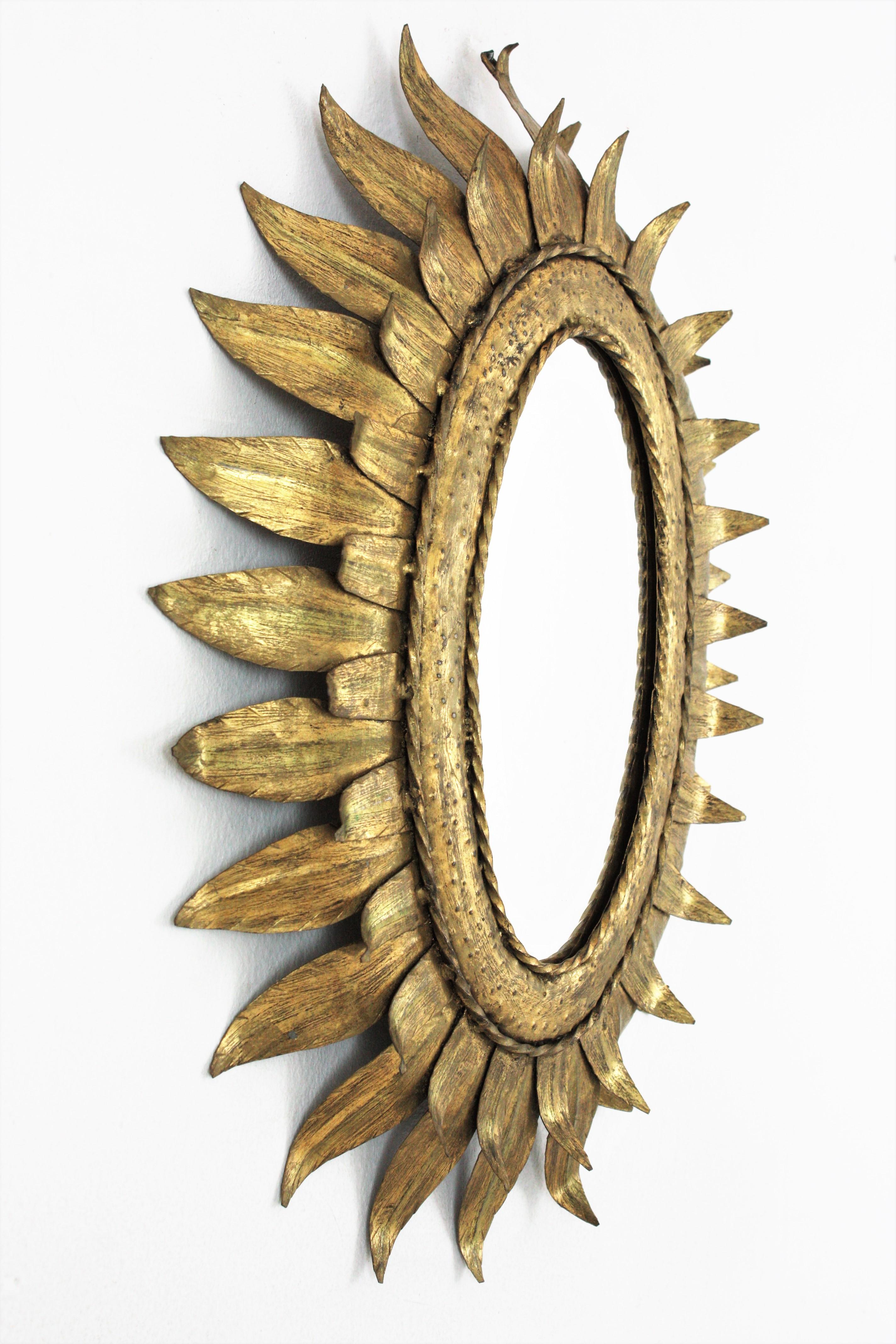 Mid-Century Modern French Sunburst Oval Mirror in Gilt Metal with Double Leafed Frame For Sale