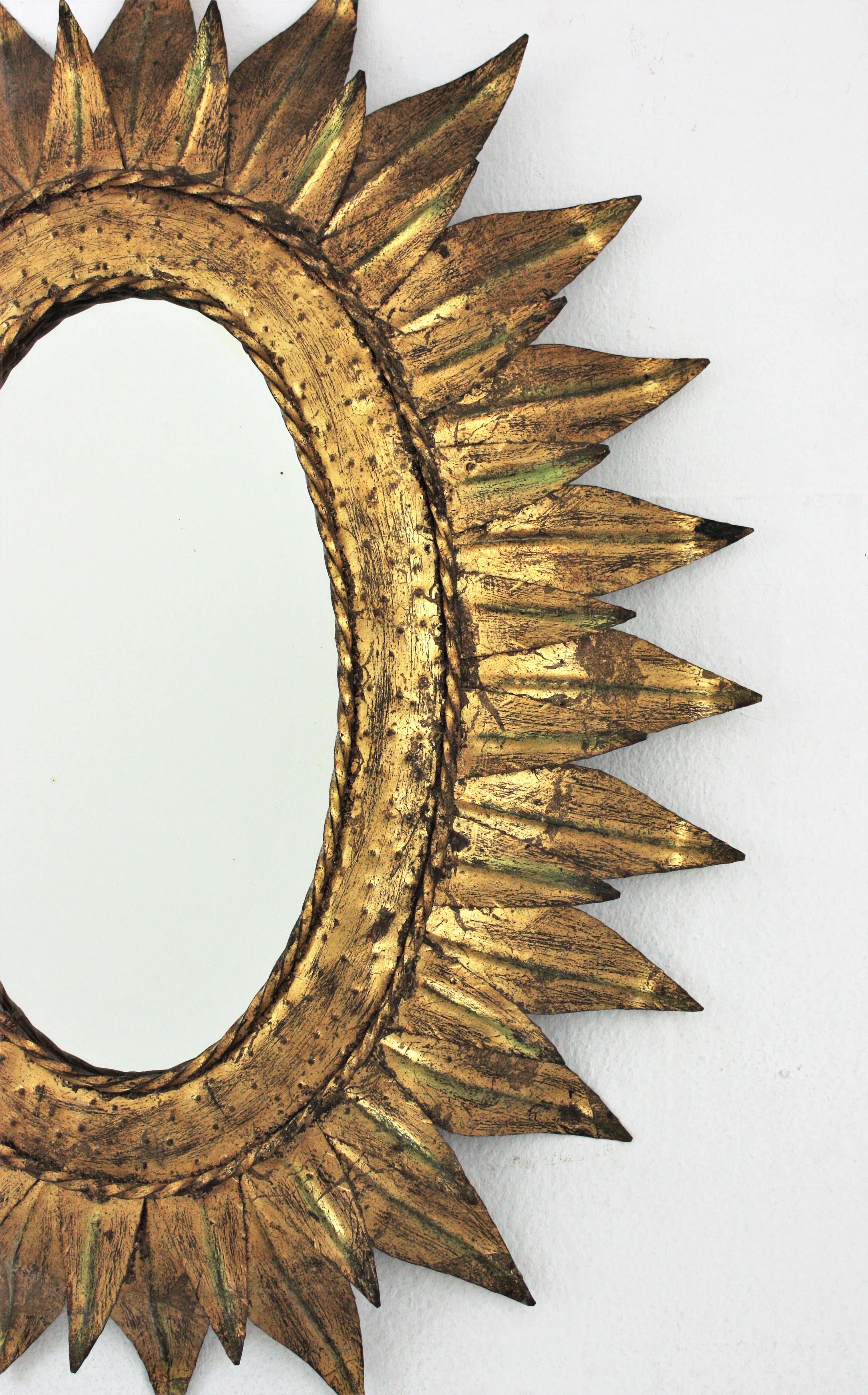 20th Century Sunburst Oval Mirror in Gilt Metal with Double Leafed Frame, France, 1950s