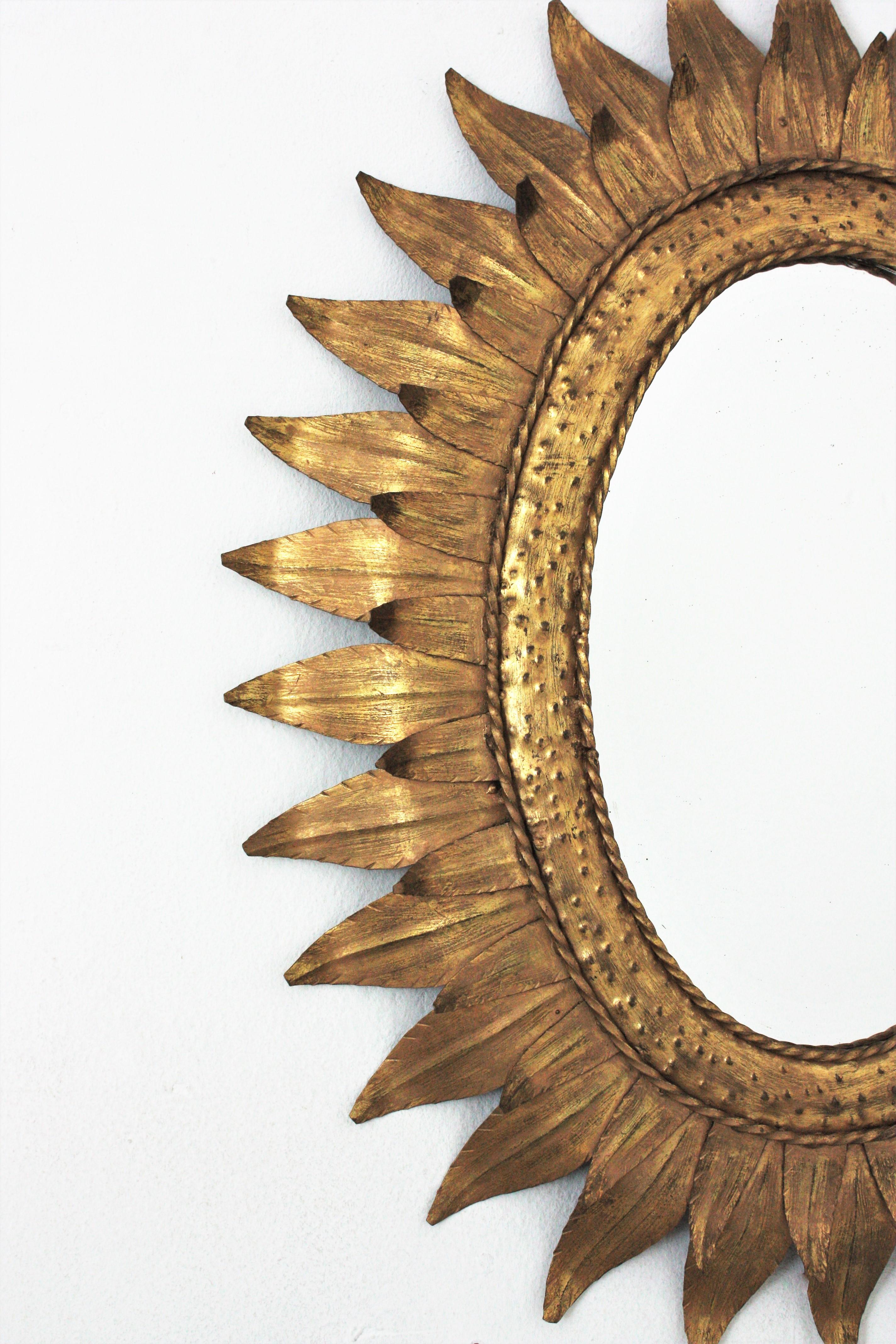 Sunburst Oval Mirror in Gilt Metal with Double Leafed Frame, France, 1950s  In Good Condition In Barcelona, ES