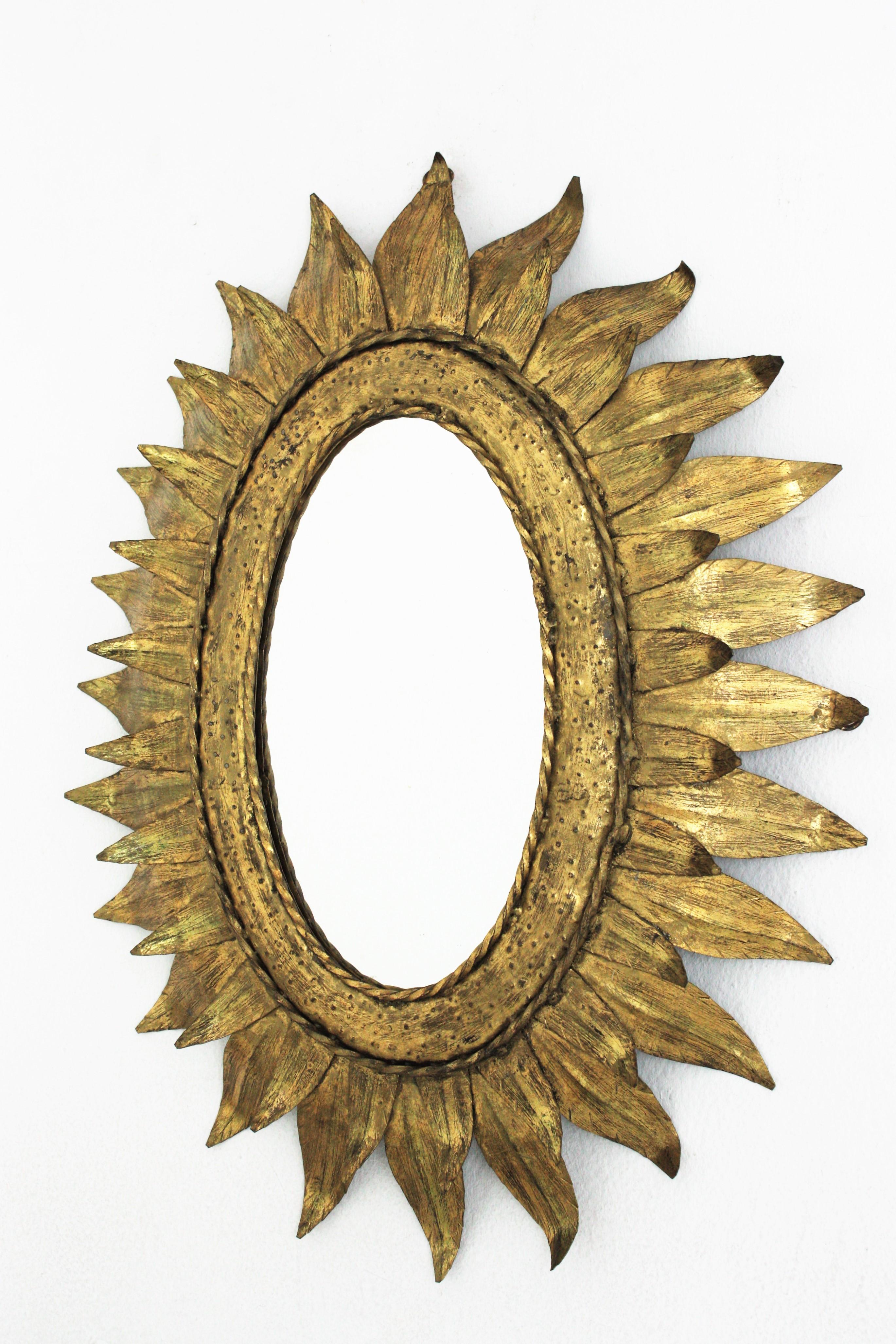 French Sunburst Oval Mirror in Gilt Metal with Double Leafed Frame For Sale 1