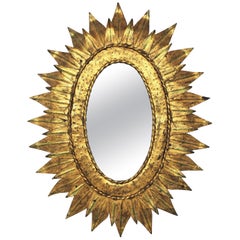 Sunburst Oval Mirror in Gilt Metal with Double Leafed Frame, France, 1950s