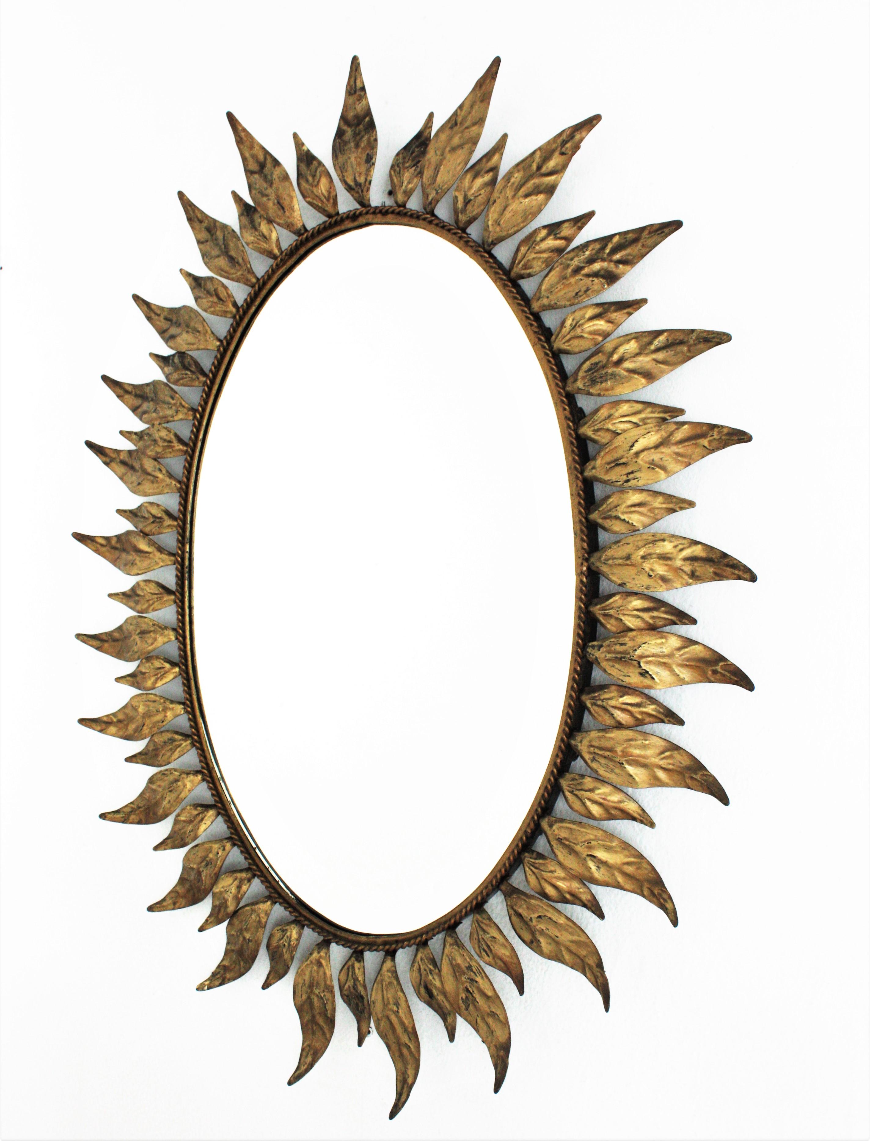 Sunburst Oval Mirror in Gilt Metal with Leafed Frame For Sale 2