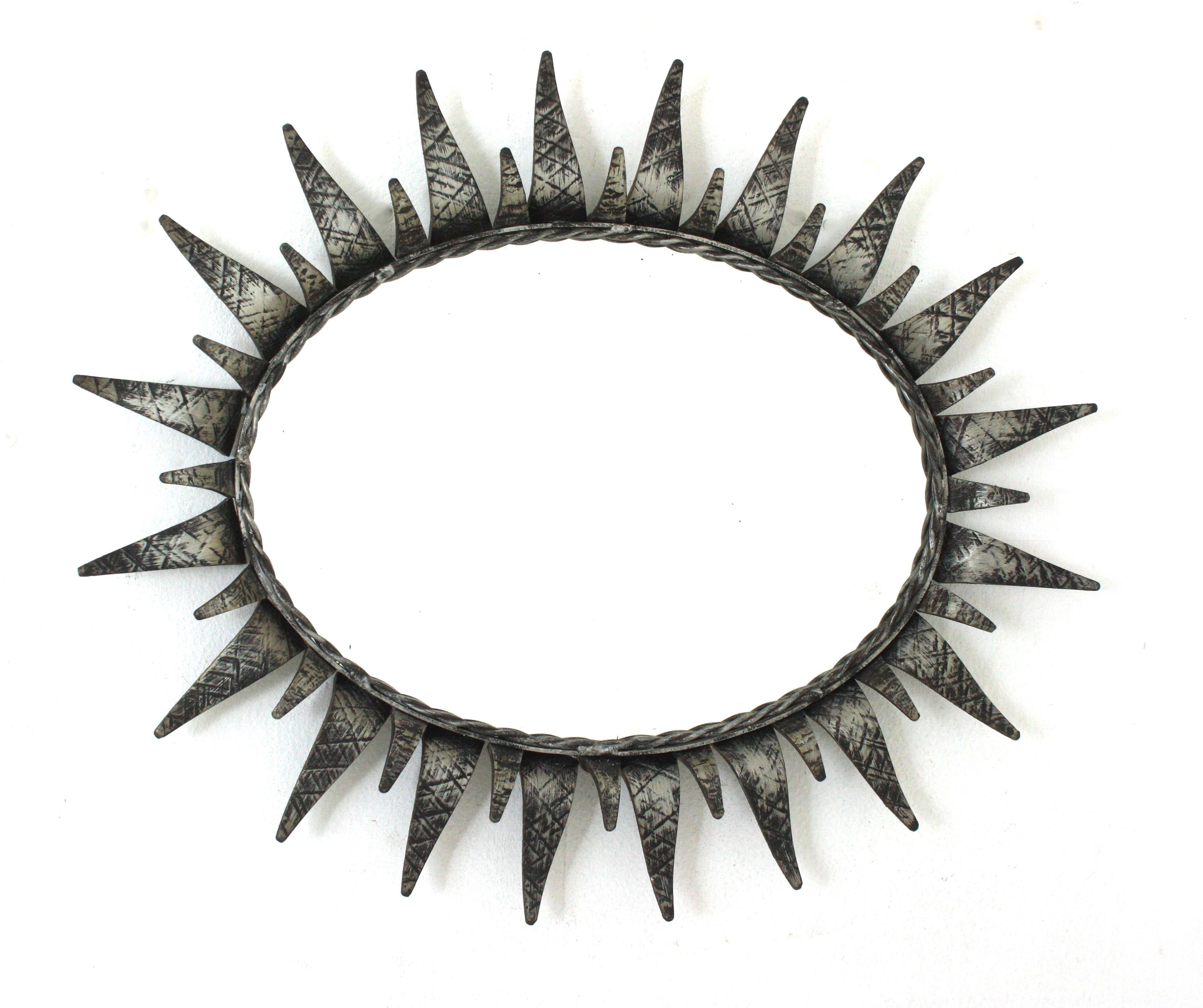 Mid-Century Modern Sunburst Oval Mirror in Silver Patinated Iron For Sale