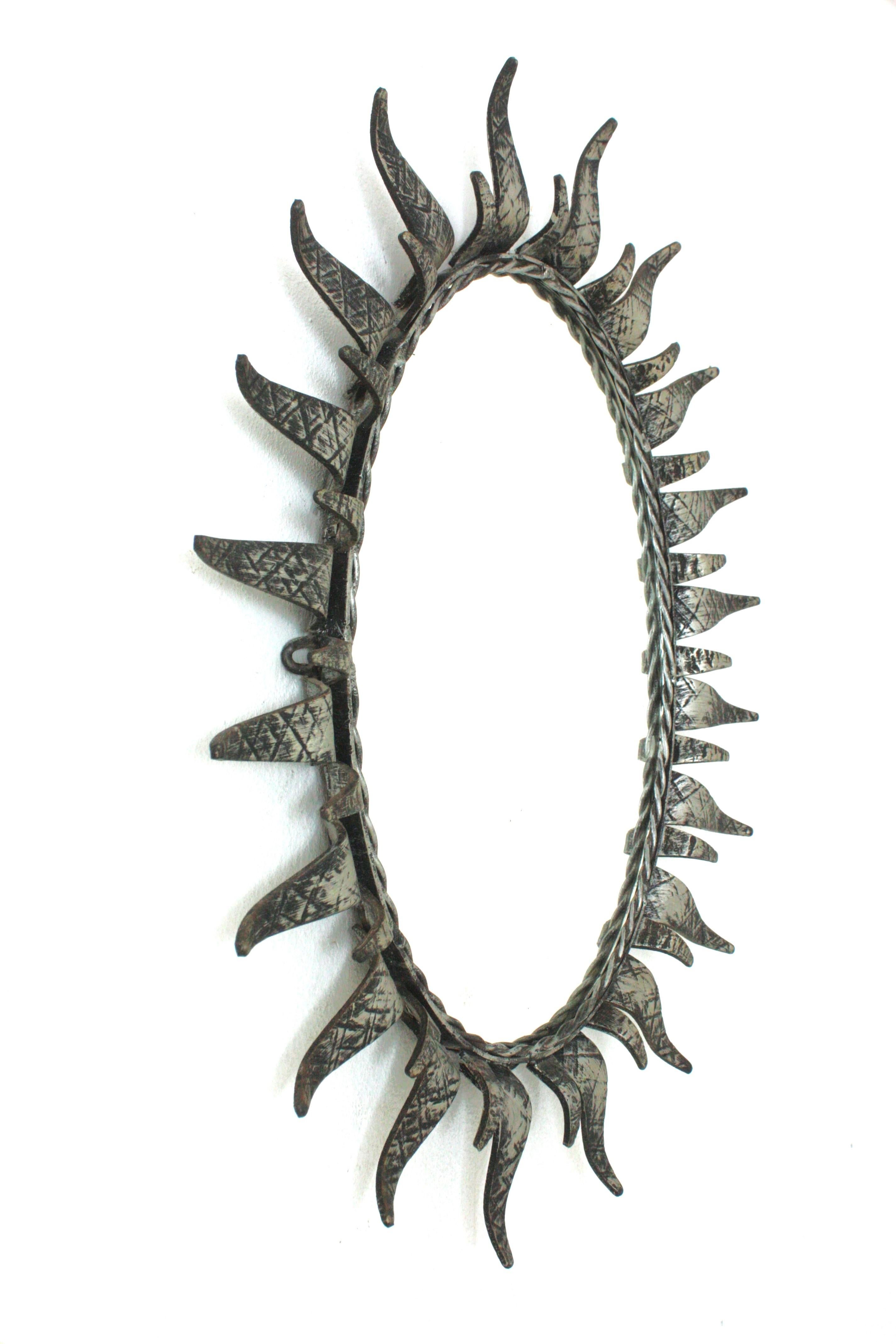 Silvered Sunburst Oval Mirror in Silver Patinated Iron For Sale