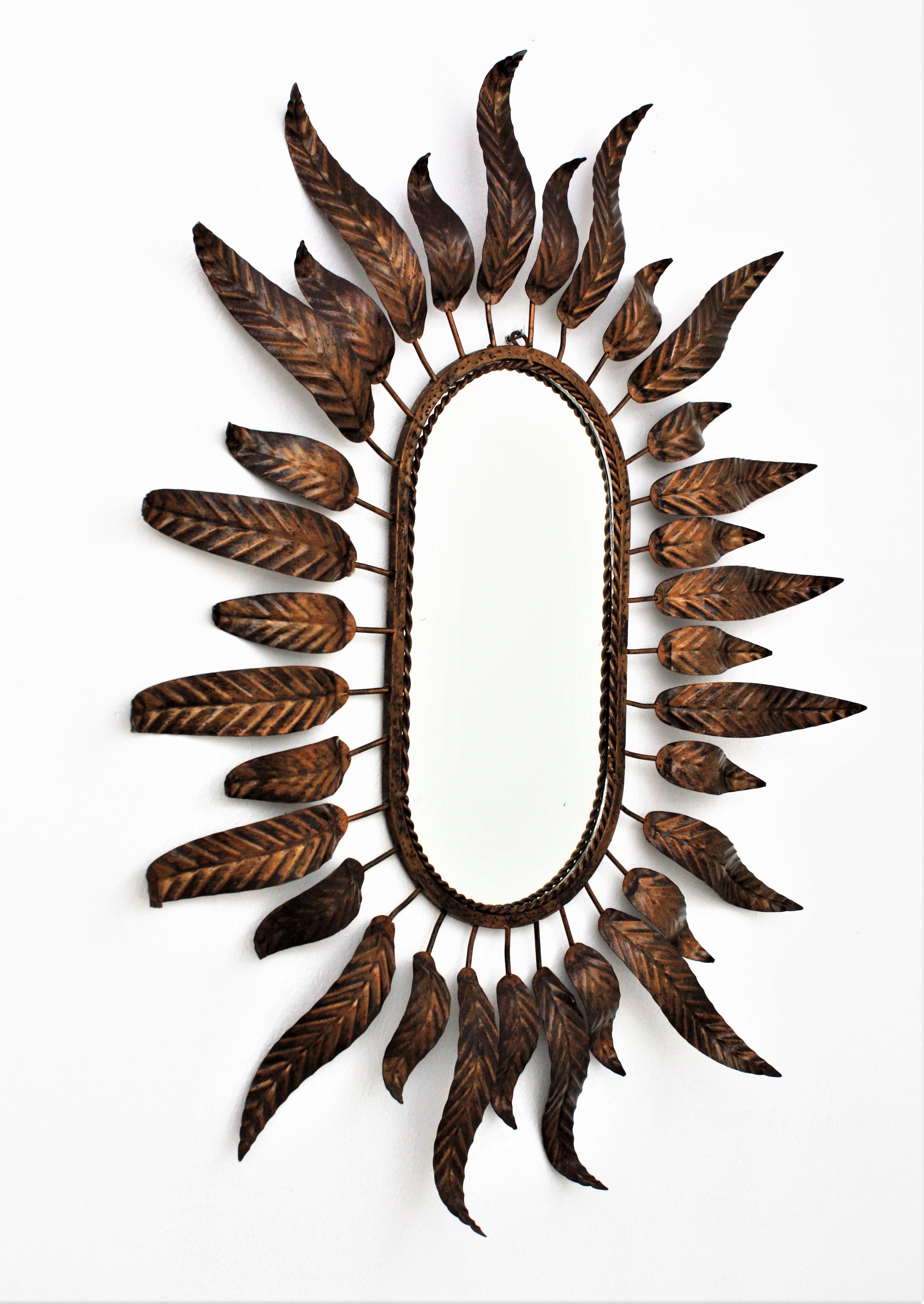 Mid-Century Modern Sunburst Oval Mirror with Leafed Frame in Bronze Gilt Metal