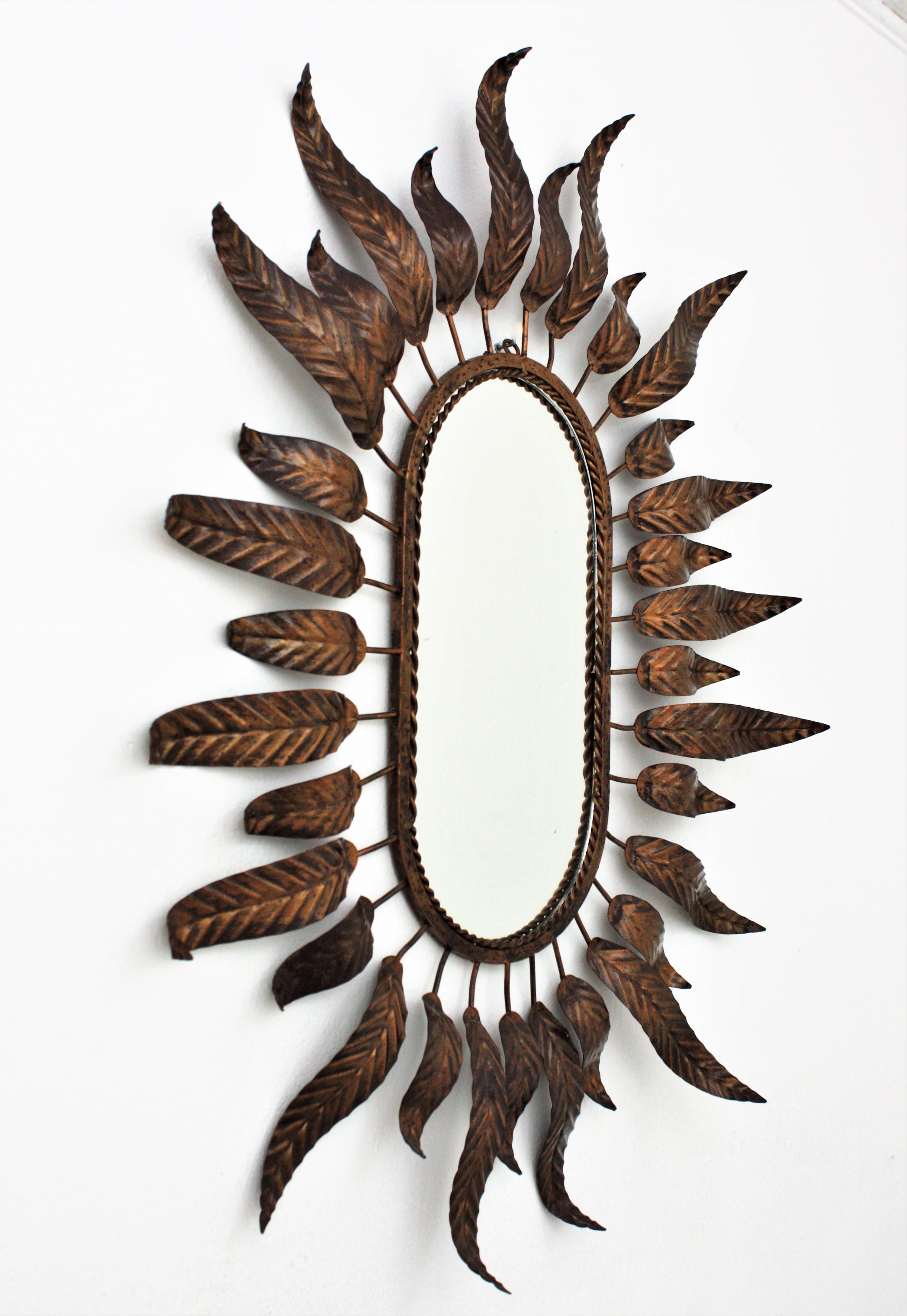 Spanish Sunburst Oval Mirror with Leafed Frame in Bronze Gilt Metal