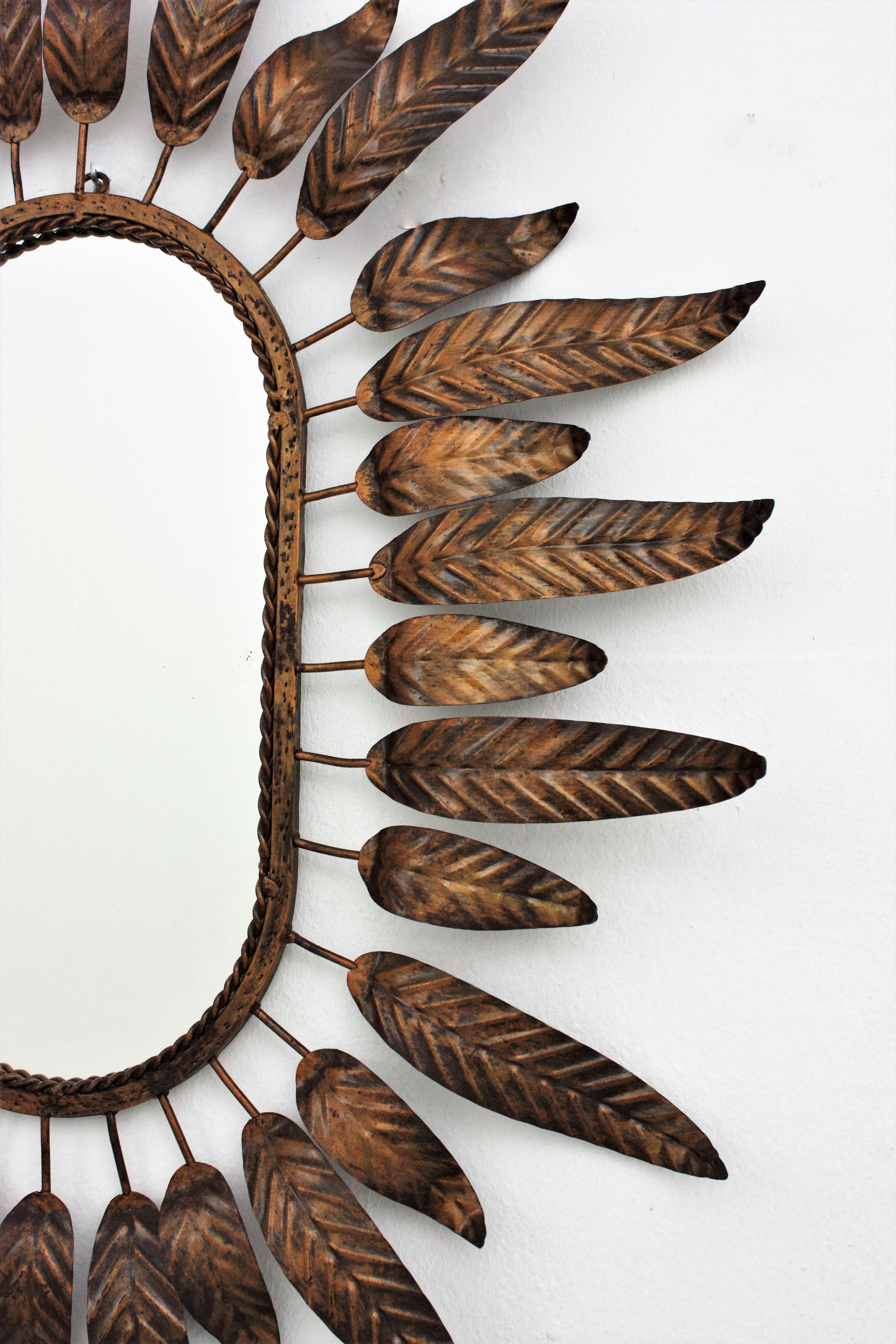 Sunburst Oval Mirror with Leafed Frame in Bronze Gilt Metal In Good Condition In Barcelona, ES