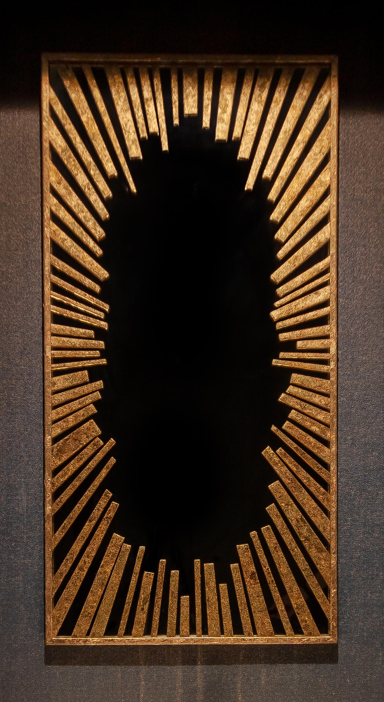 The bright and sunny mirror has a gold radial pattern like the sun’s rays. It forms a golden crown around the clear part of the mirror and your reflection. The gold rays, made of a textured metal leaf (gold color), are inside the glass pane, so it