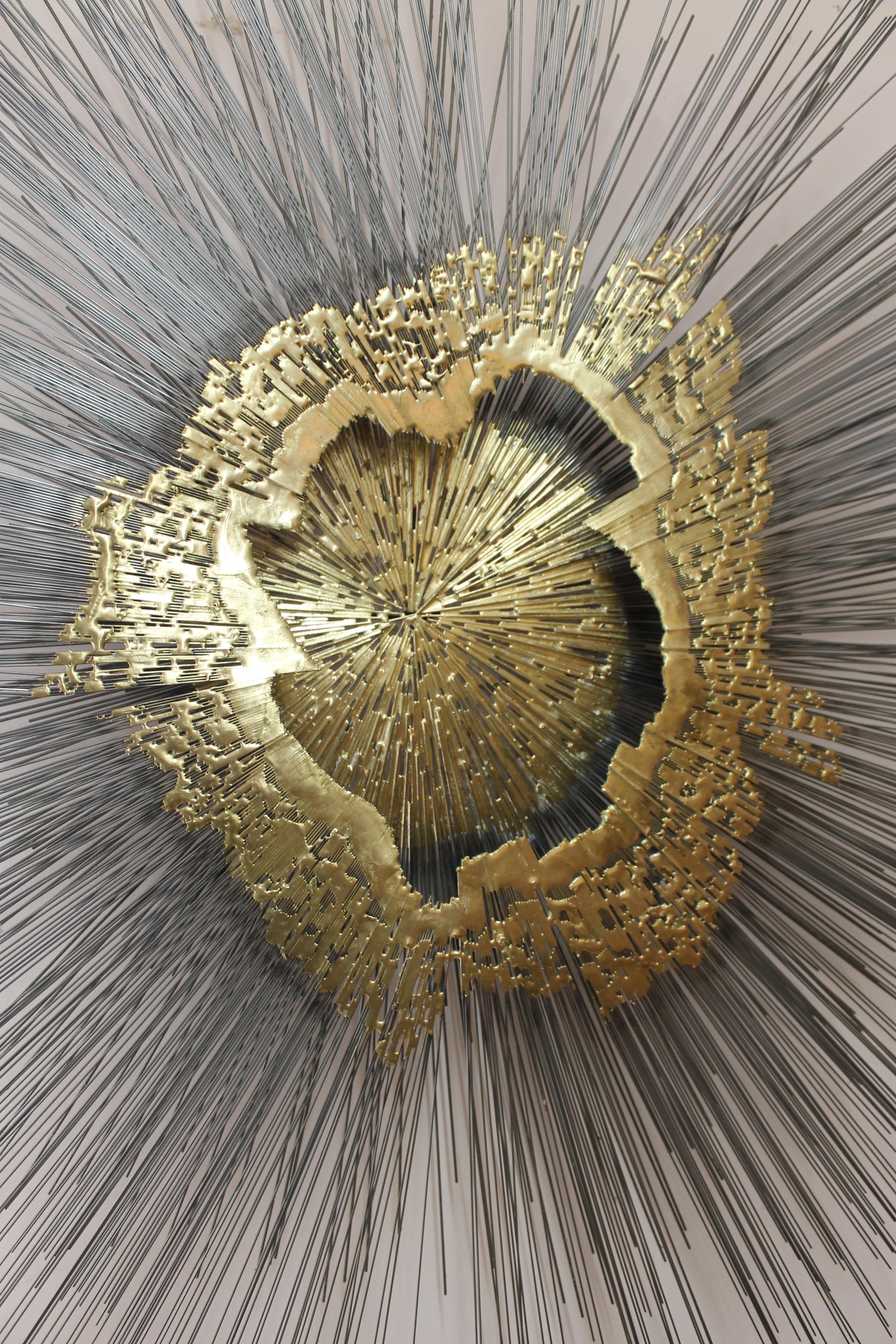 Monumental 2-tier sunburst wall sculpture by Santa Fe artist Fredrick Prescott.  Sunburst is gold steel.  Sculpture is 53