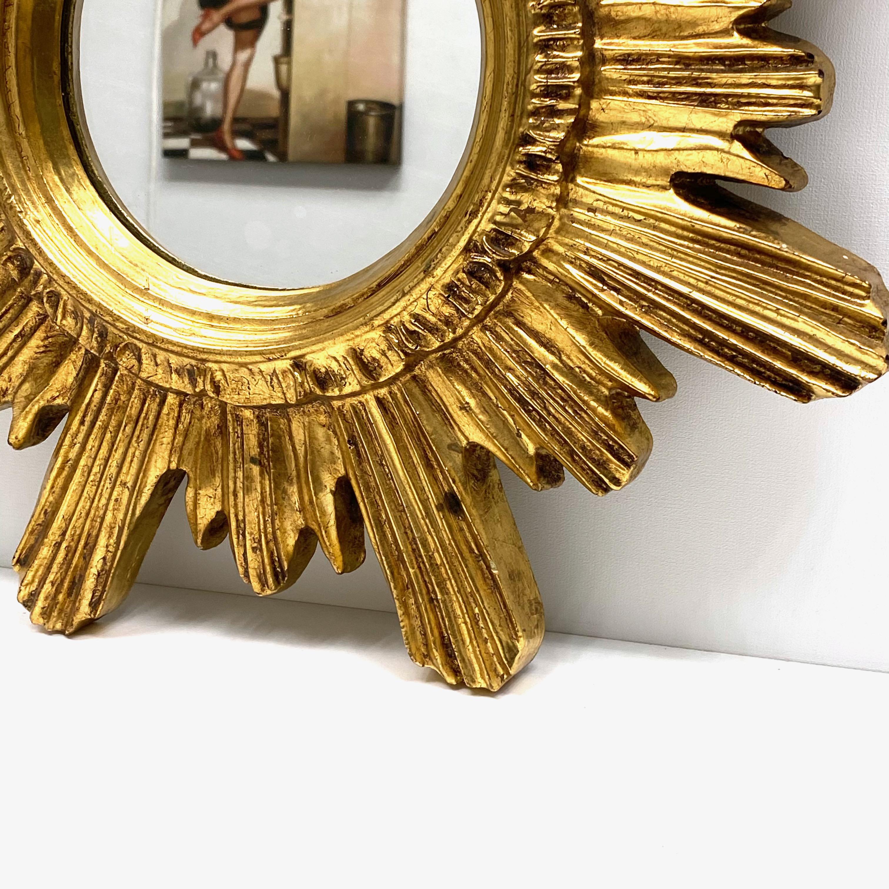 A gorgeous starburst mirror. Made of gilded polystyrene Styrofoam. No chips, no cracks, no repairs. It measures approximate 16 1/2