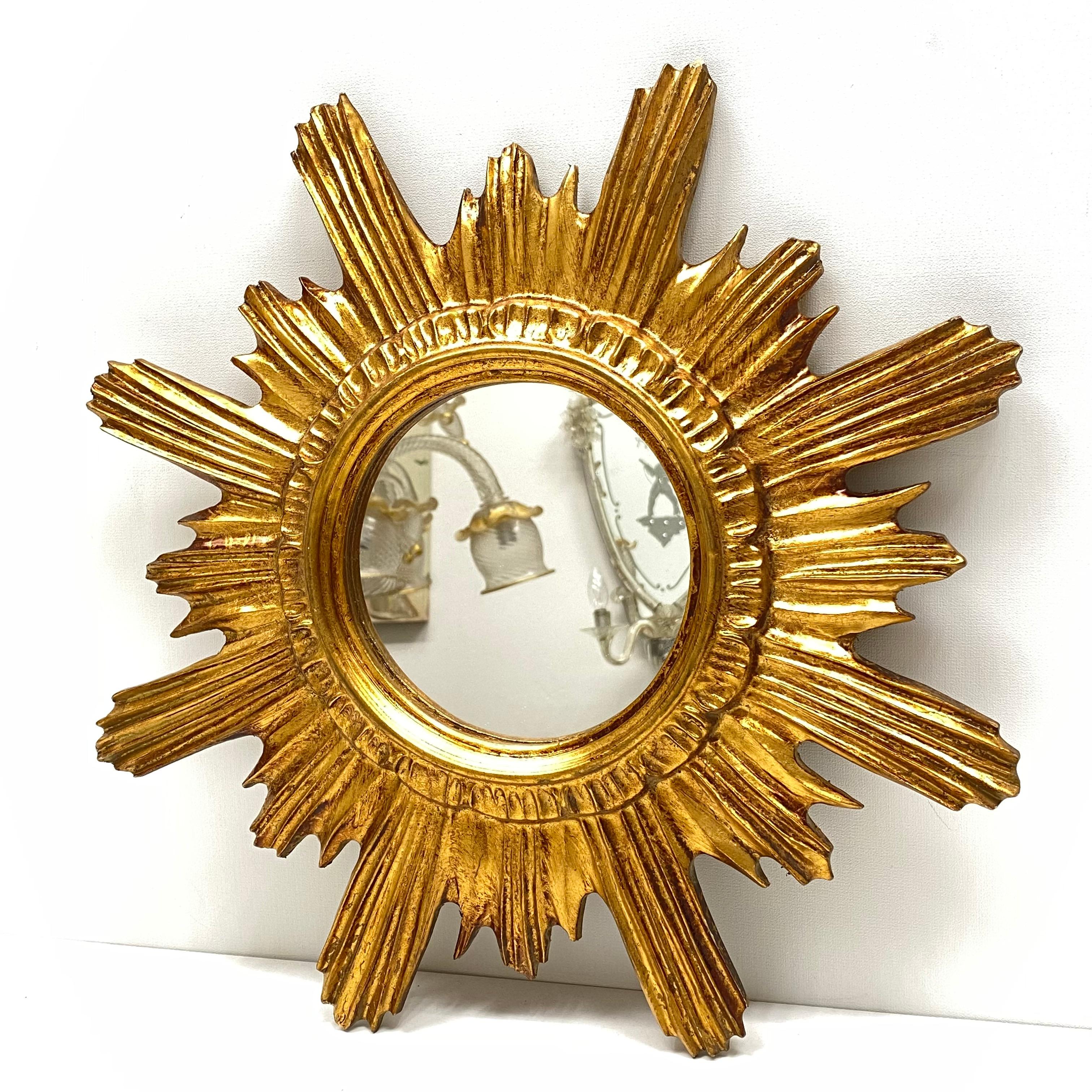 A gorgeous starburst mirror. Made of gilded wood and composition. No chips, no cracks, no repairs. It measures approximate: 16.63