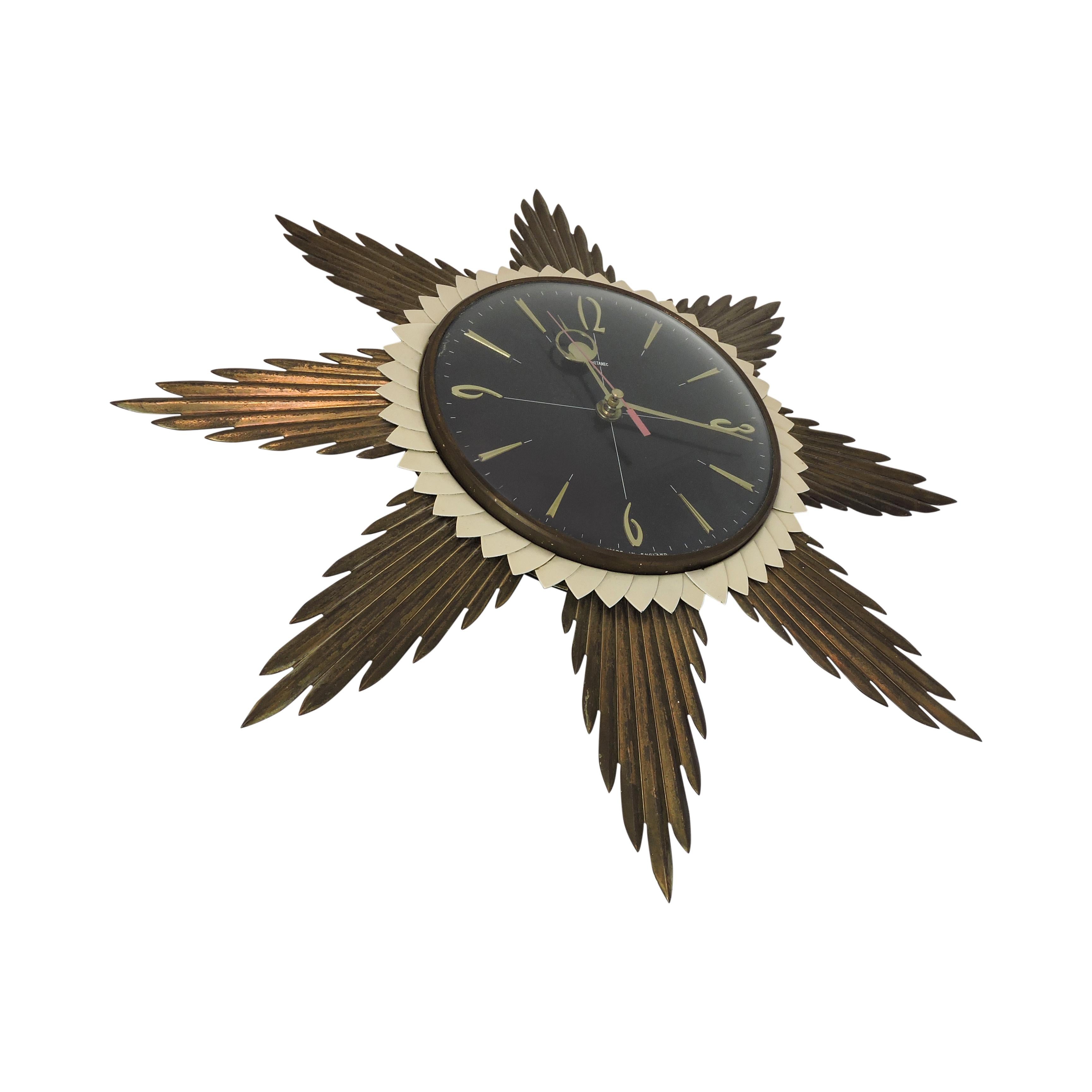 This wall clock with a sun-themed shape was made by Metamec in the UK in the 1960s. It has been updated with quartz movement.
 
