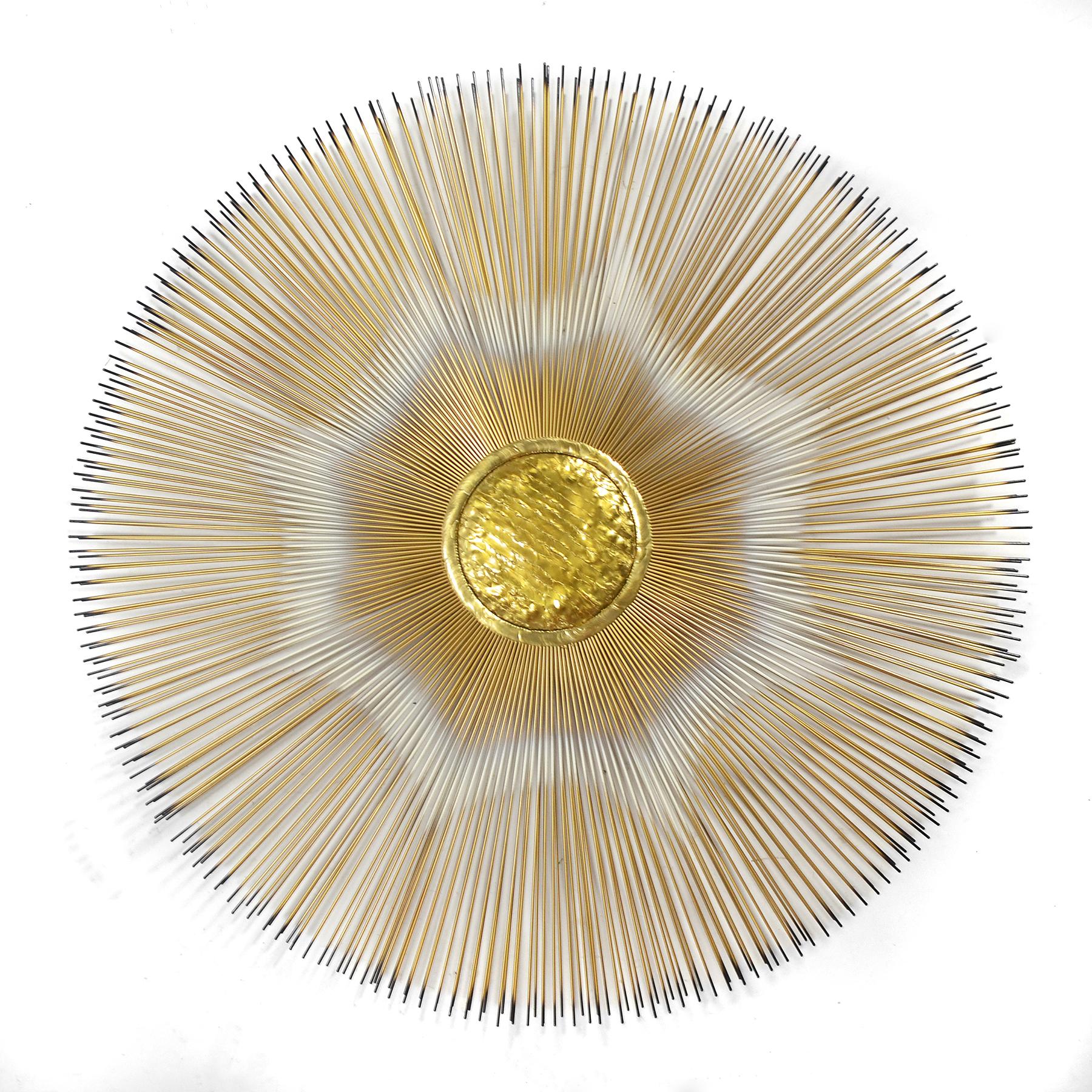 A terrific wall sculpture in the form of a sunburst in brass with painted details and a nicely textured center. While similar in aesthetic to C. Jere, this work is more complex and shows a greater degree of sophistication. Signed 