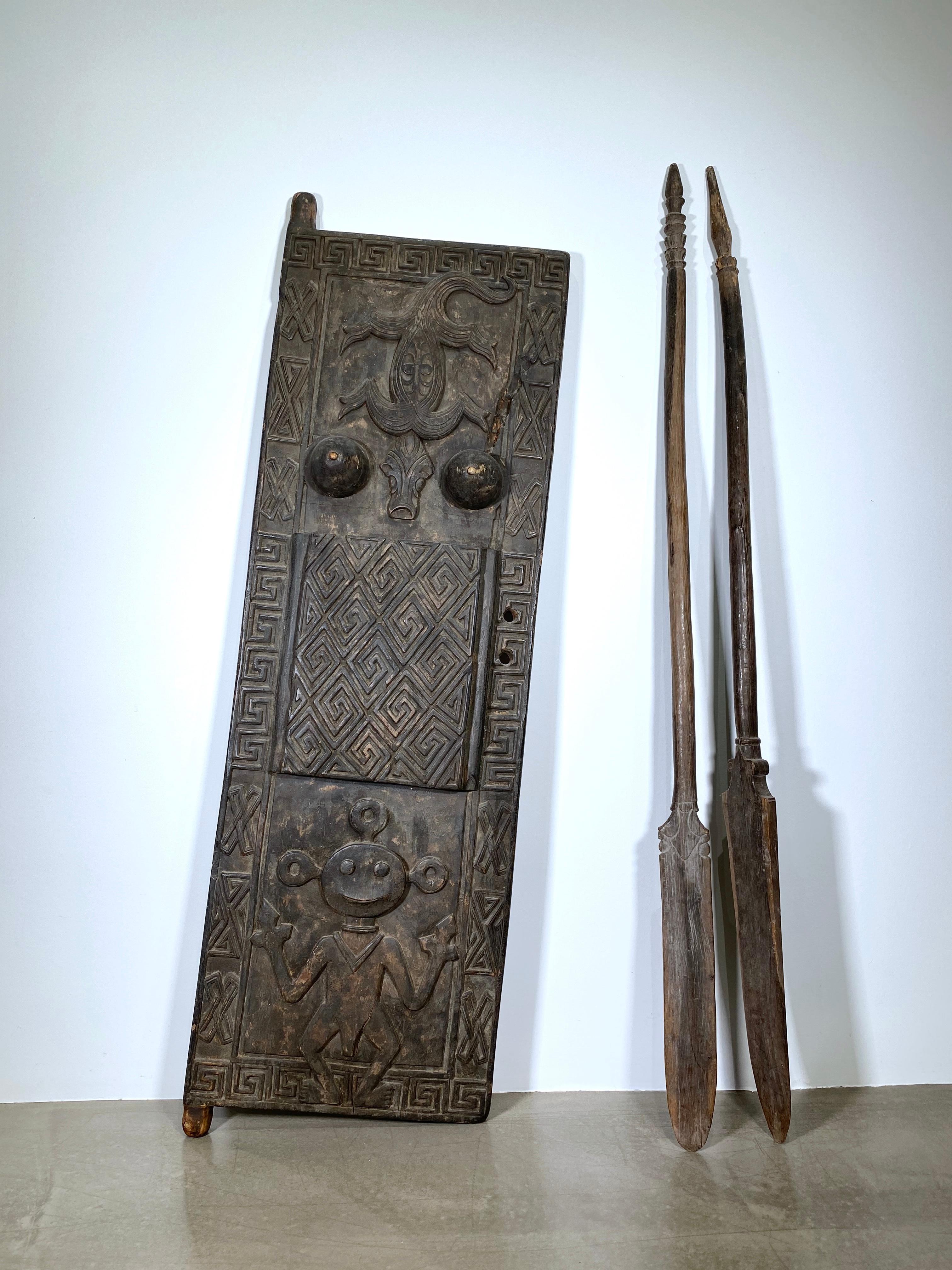 Old, heavy hand-carved entrance door of a shaman / healer / magician (“Dukun”) from the Sunda Islands, crafted from dense ironwood.

This remarkable piece shows a strong visual and symbolic connection to the Asmat culture of Papua.

The central