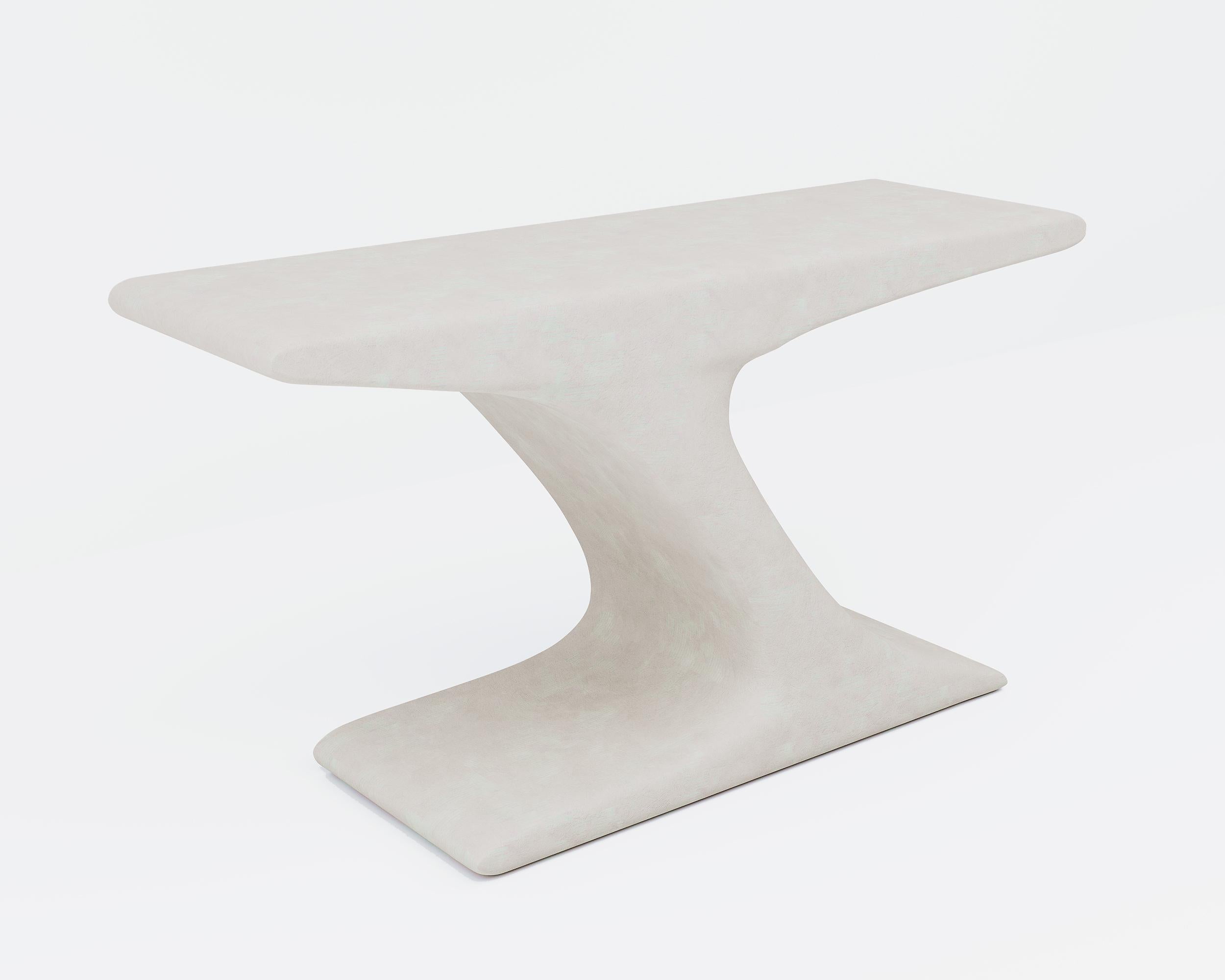 A sculpted console in concrete. Smooth lines and a high polished surface evoke a sense of tranquil strength and serenity.
Meticulously hand crafted in Portland, Oregon, the console has a powerful personality that anchors a room with a strong yet