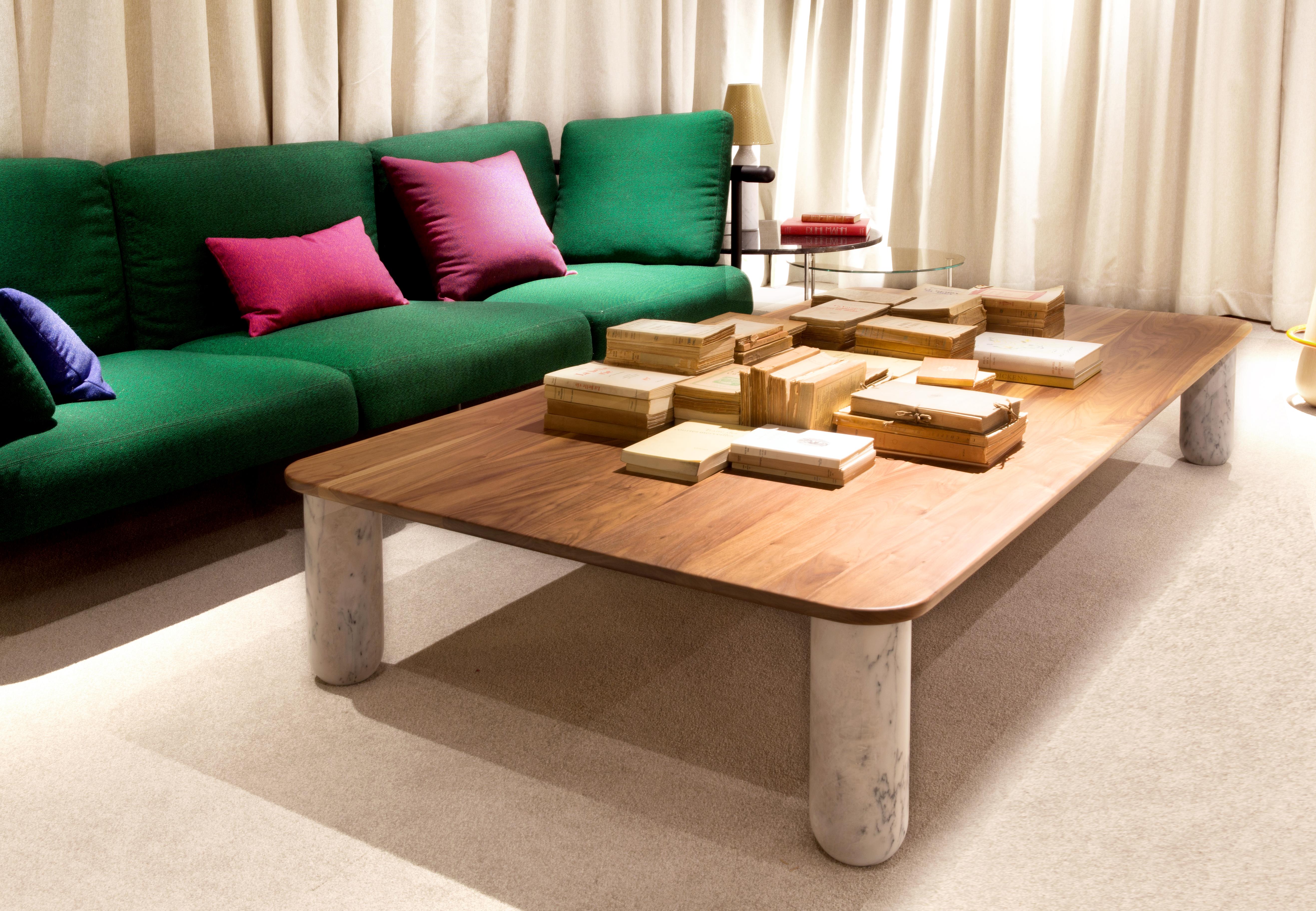 Sunday is a family of coffee tables and low consoles with a simple and clean design vocabulary. The combination of heavy marble legs with the thin solid wood or marble top creates an interesting contrast while the rounded edges and generous